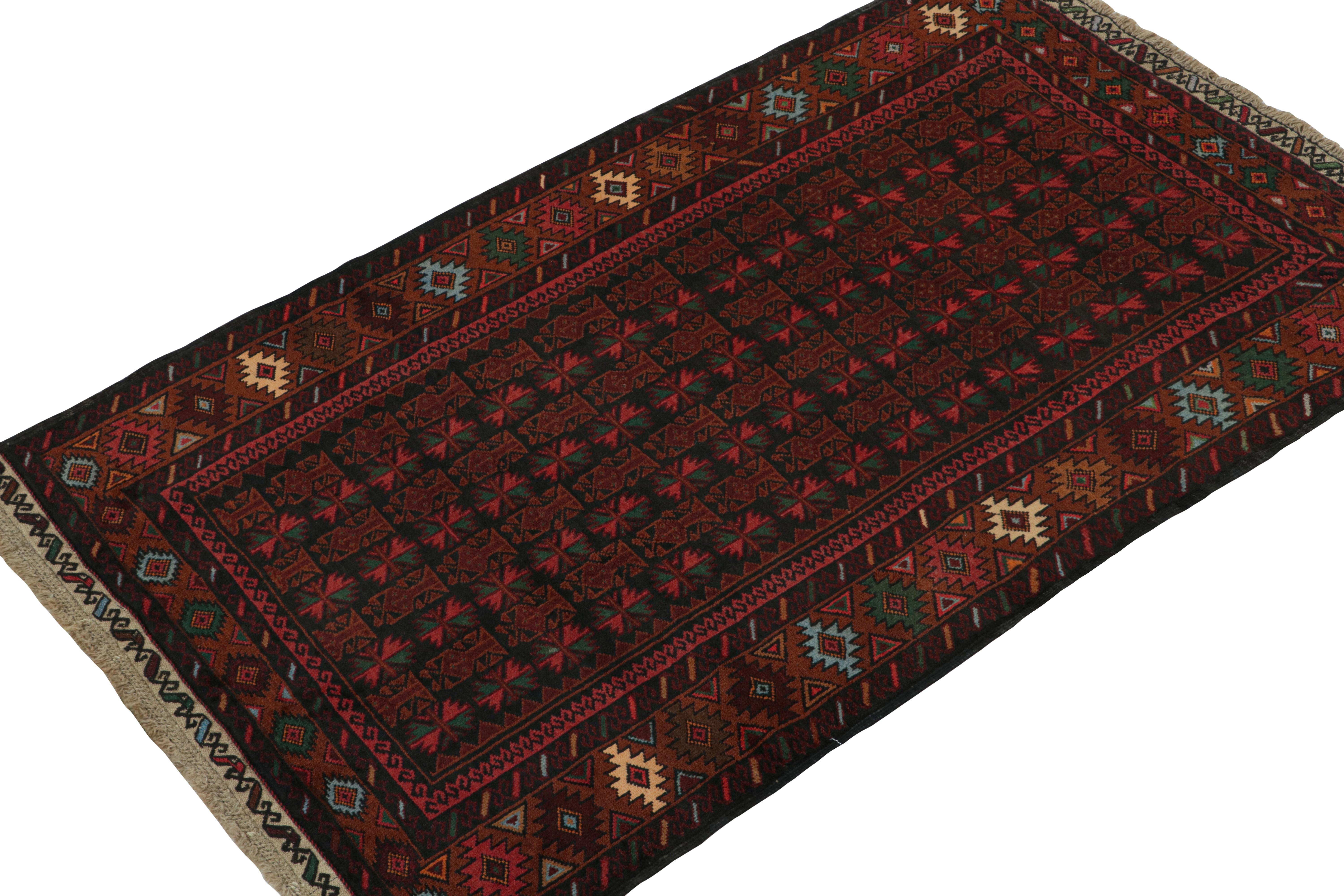 Hand-knotted in wool and goat hair circa 1950-1960, this 4x6 vintage Baluch tribal rug is a rare new curation from Rug & Kilim. 

On the Design: 

This piece enjoys a rich  brown undertone with notable red and teal tones in its geometric patterns.
