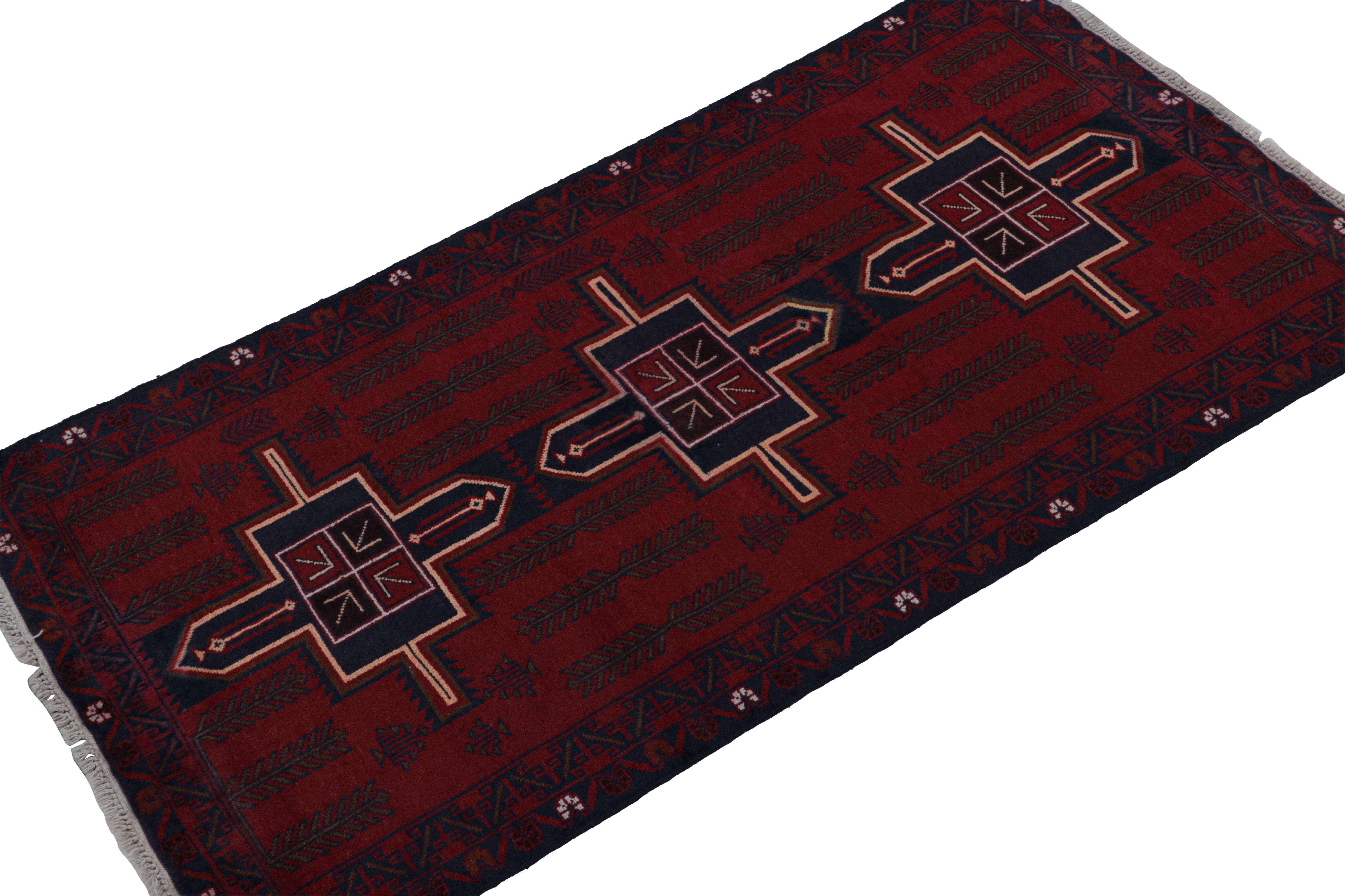 Hand-knotted in wool and goat hair circa 1950-1960, this 3x7 vintage tribal runner is a Baluch rug in an exciting curation from Rug & Kilim.

On the Design: 

This piece enjoys the rich burgundy and navy blue tones favored in this provenance. A