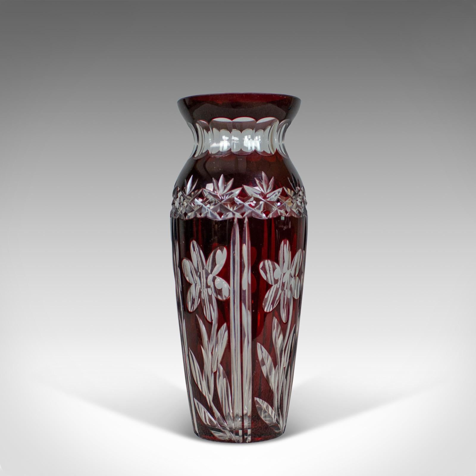 This is a vintage baluster glass vase, a claret-colored cut glass vase in the Art Deco taste from the mid-20th century.

Attractive vase with a striking claret color
Cut decoration to all facets
In good proportion and of quality