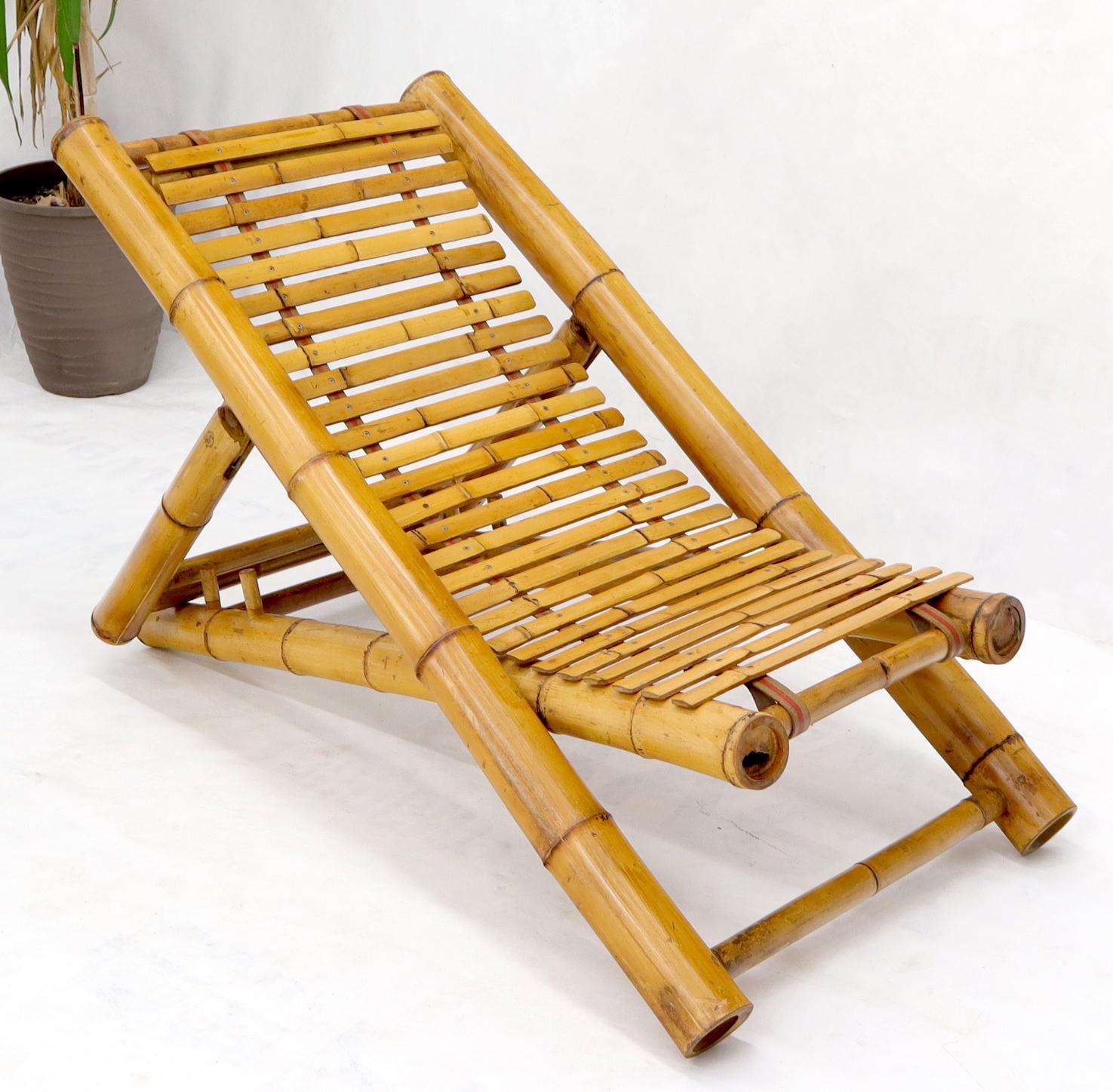 Mid-Century Modern large diameter bamboo frame adjustable sling design chaise lounge.