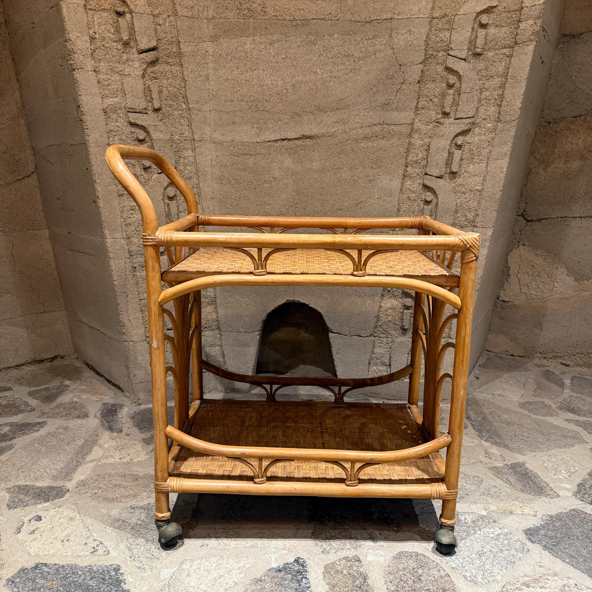 For your consideration, a vintage bamboo and rattan bar cart (or serving trolley), typically found in coastal, bohemian, or Mid-Century Modern decor styles. These carts often date back to the 1960s or 1970s and feature natural materials and a