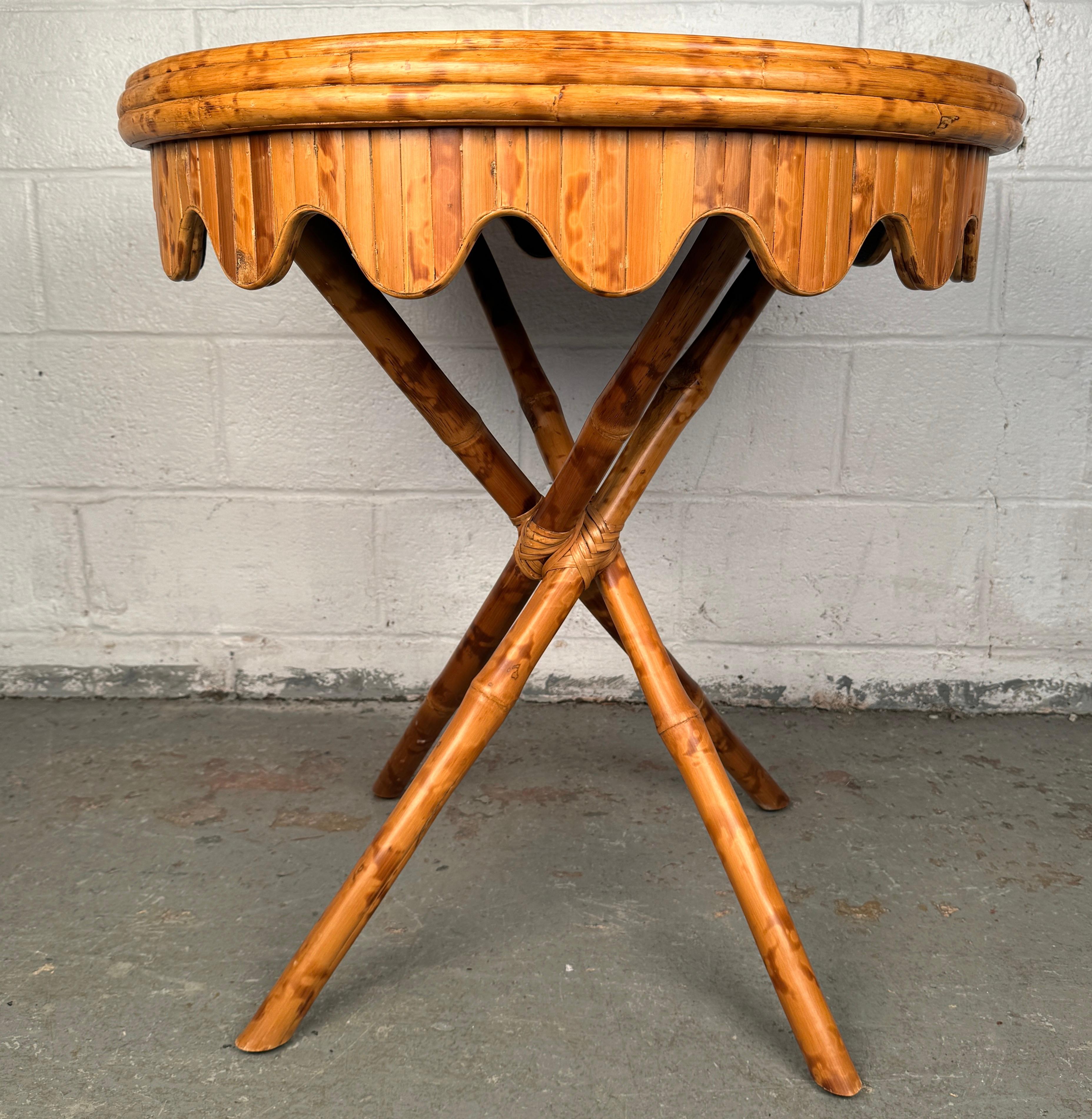 Add a touch of organic elegance to your space with this vintage bamboo table, a beautifully crafted piece that blends tropical charm with mid-century style. Lightweight yet sturdy, this table features handwoven cane accents and the warm golden tones