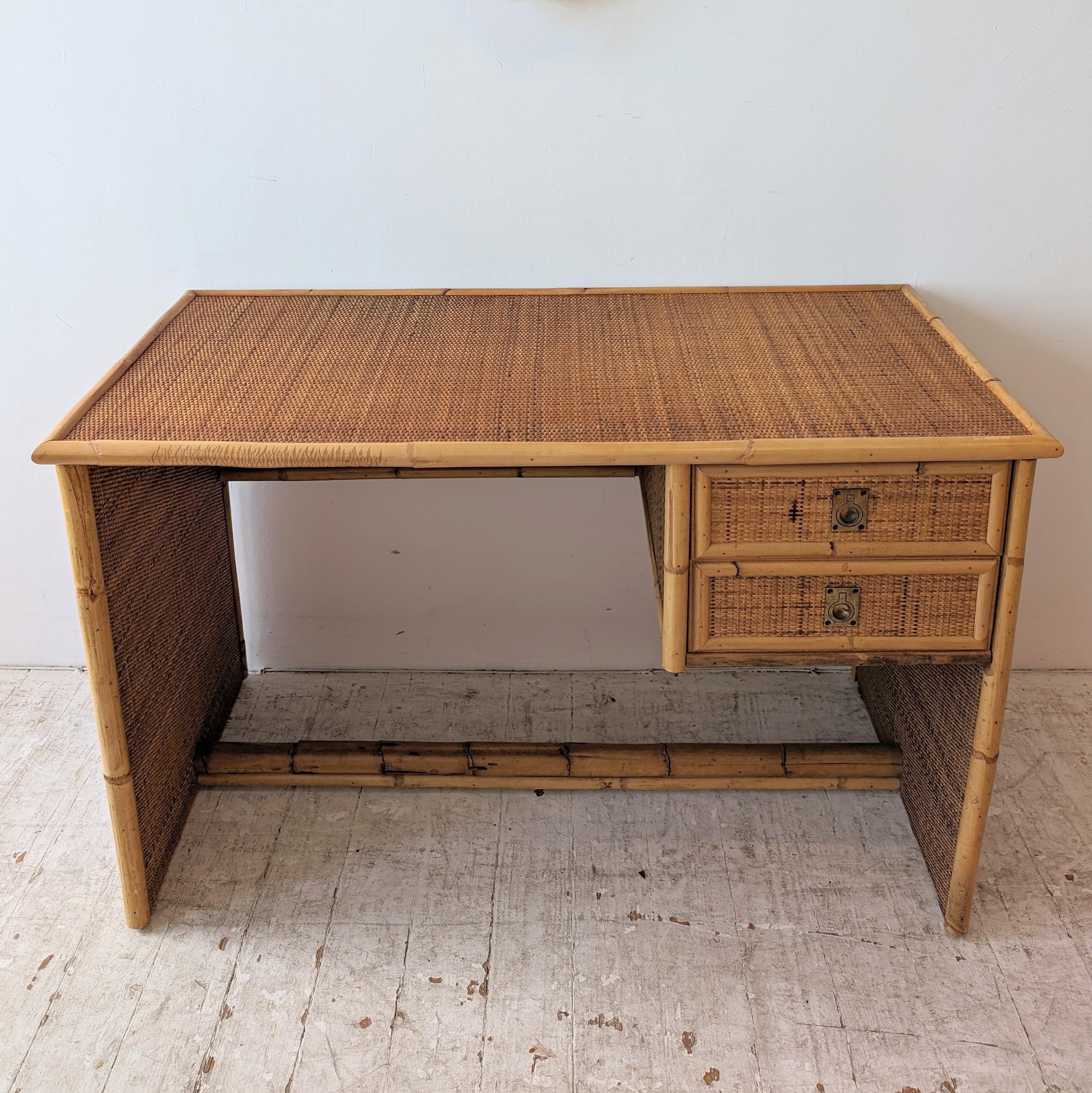 Vintage bamboo and rattan desk / dressing table by Dal Vera, Italy 1970s. Two drawers with brass ring-pull handles. Bamboo foot rest, rattan modesty panel. There's a slight natural curve in the right hand bamboo upright.
The matching chair in the