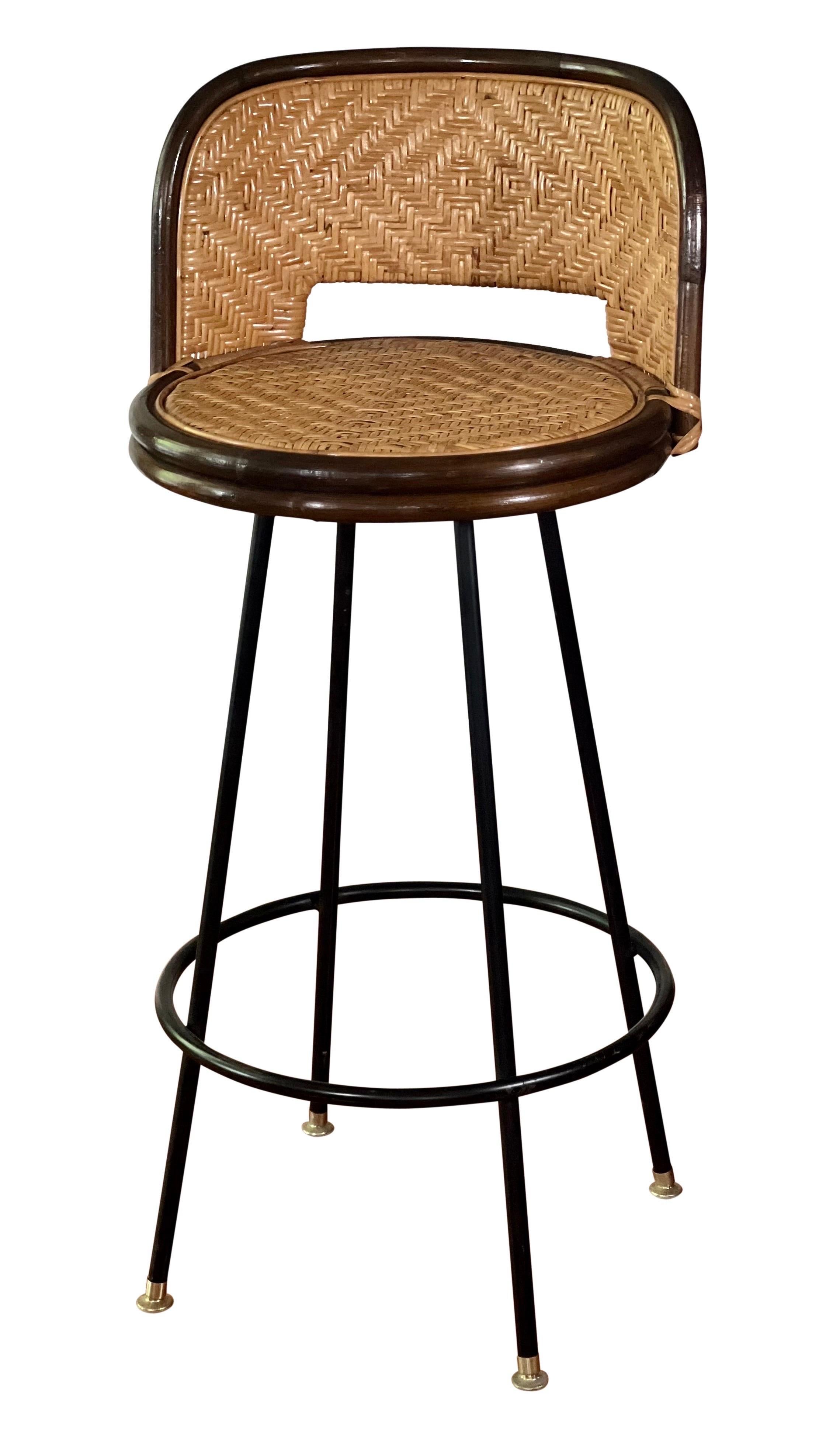 Vintage midcentury bamboo and rattan swivel bar stools with iron base.

Great set of 4 barstools in very good condition. Comfortable and sturdy, all stools swivel smoothly. A beautiful set.