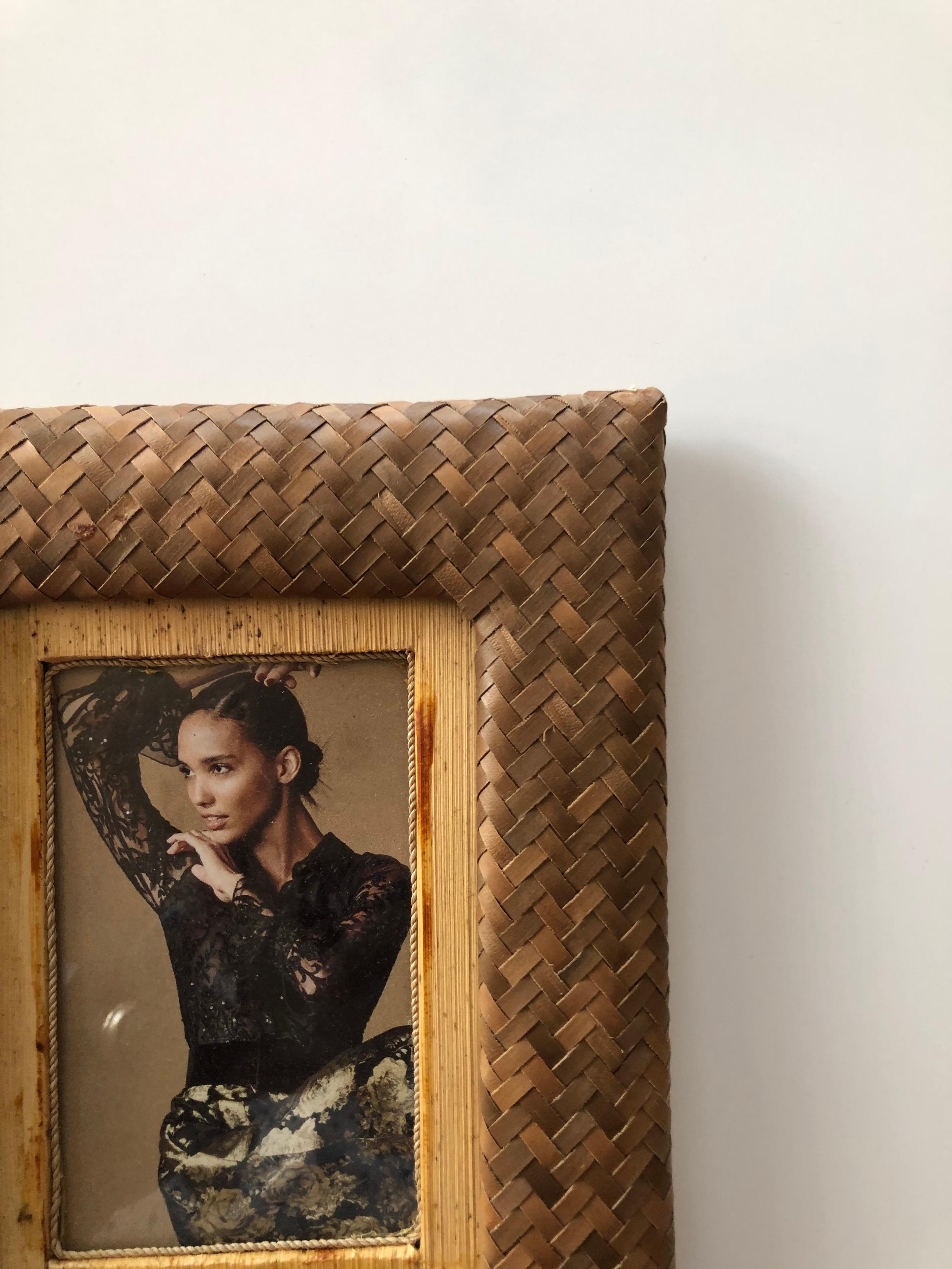 Vintage bamboo and rattan woven picture frame
Glass inset.
Size: 6 x 7.5 H x .25 D.