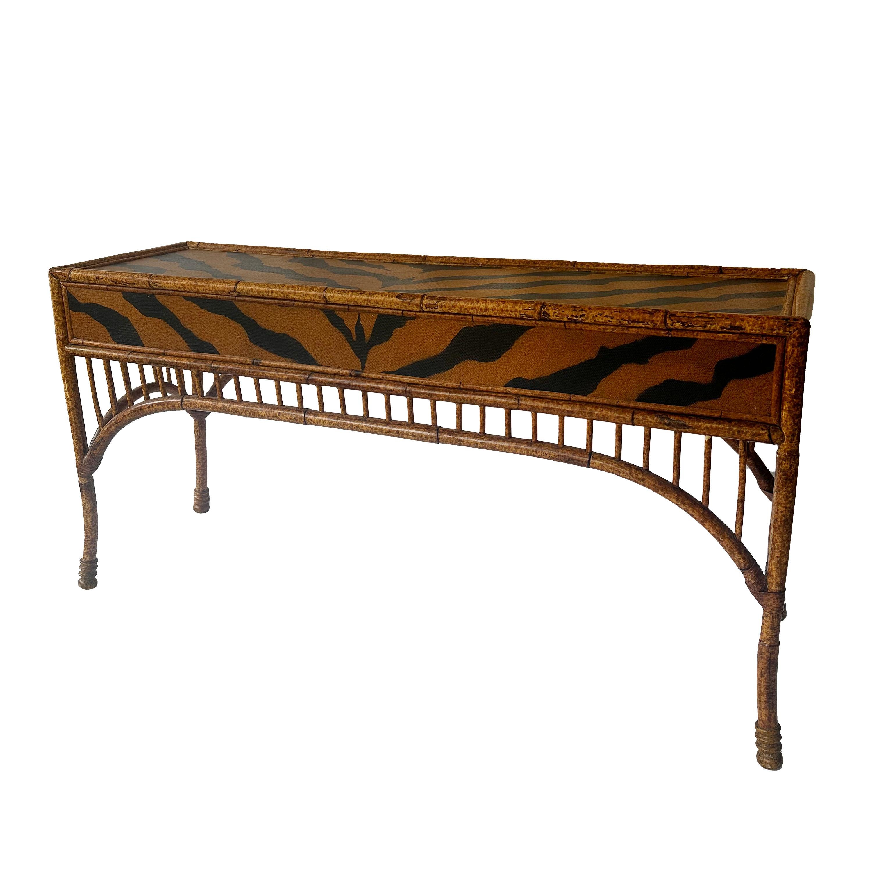 Vintage

Extremely Rare

Believed to be Maitland Smith

Mid-Century

Tortoise Shell Bamboo Frame Console Table

Features Tiger Print Woven Rattan Table Top & Back

Cheetah Print Woven Rattan Drawer Face

2 Pull Out Drawers

Shows some minor wear in