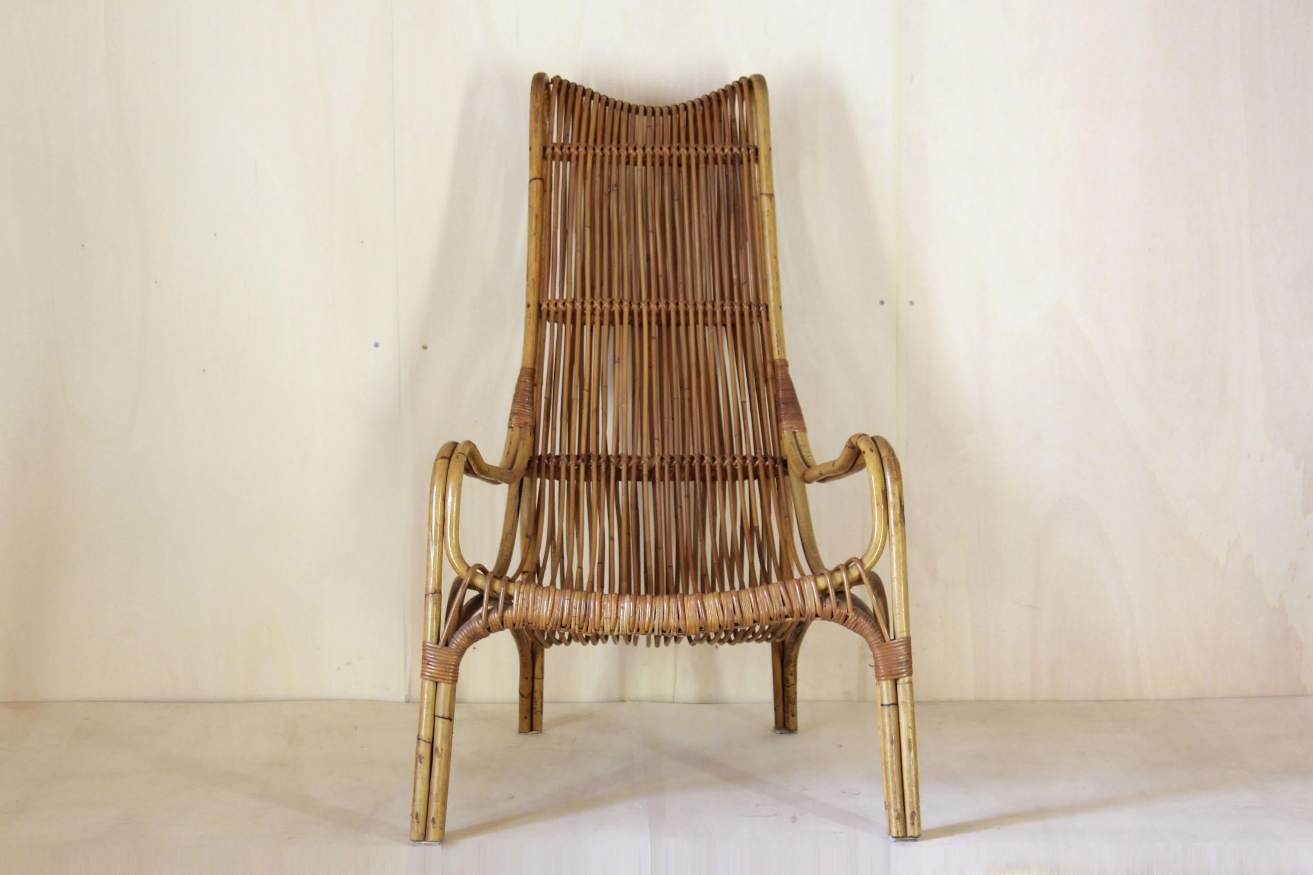 A rare 1960s rattan armchair. Curved rattan design armchair ideal for garden and patio decor. The armchair structure and the rattan are in excellent conditions.

NOTE: contact us for info and requests.  If possibile, we could take part of shipping