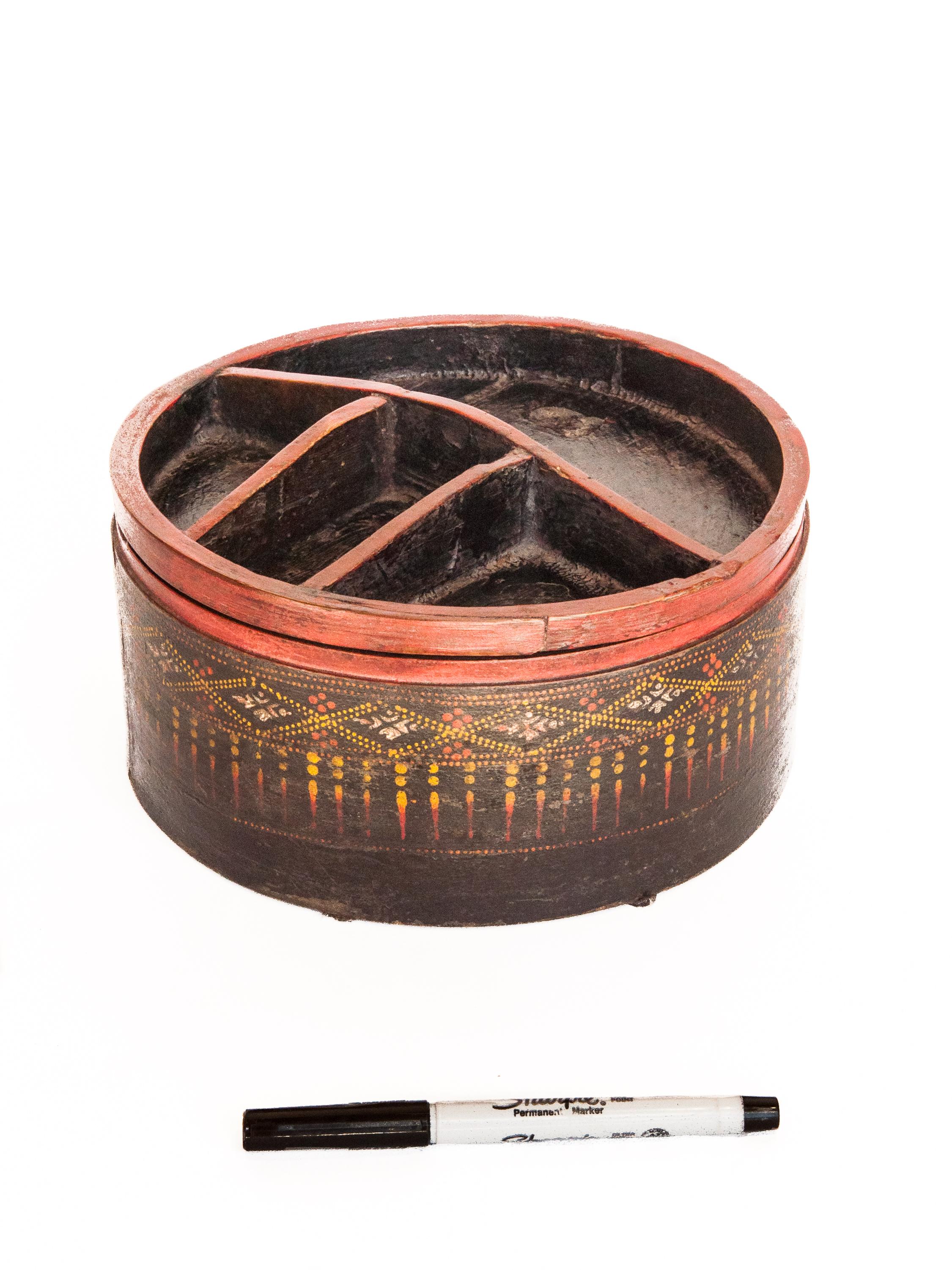 Vintage bamboo betel box/tray. Original color. Cambodia. Early to Mid-20th century.
This old bamboo box was used to hold the condiments and paraphernalia for betel nut chewing. It would be brought out whenever guests came to visit, or when the