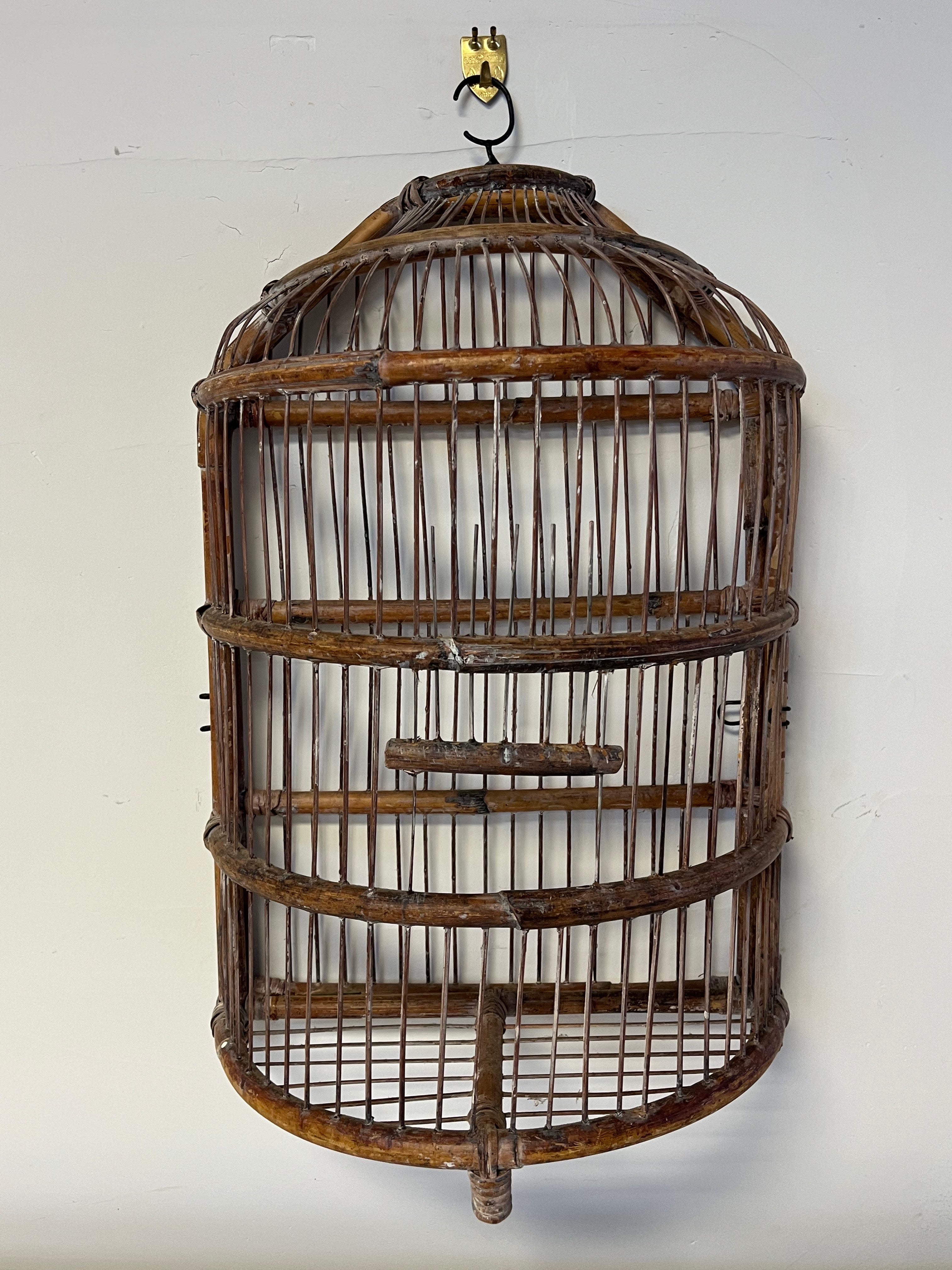Unique demilune bamboo bird cage, bamboo frame with think metal wire. lift hatch door in front. hinged to open full from back.