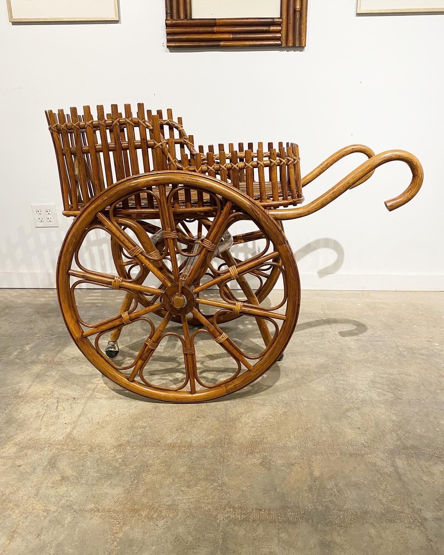 An oversized bamboo cart, likely Italian. This piece functions and rolls as it should. The woven construction is sturdy and attractive. Minor loss of the rattan wrap in places, although structurally sound.