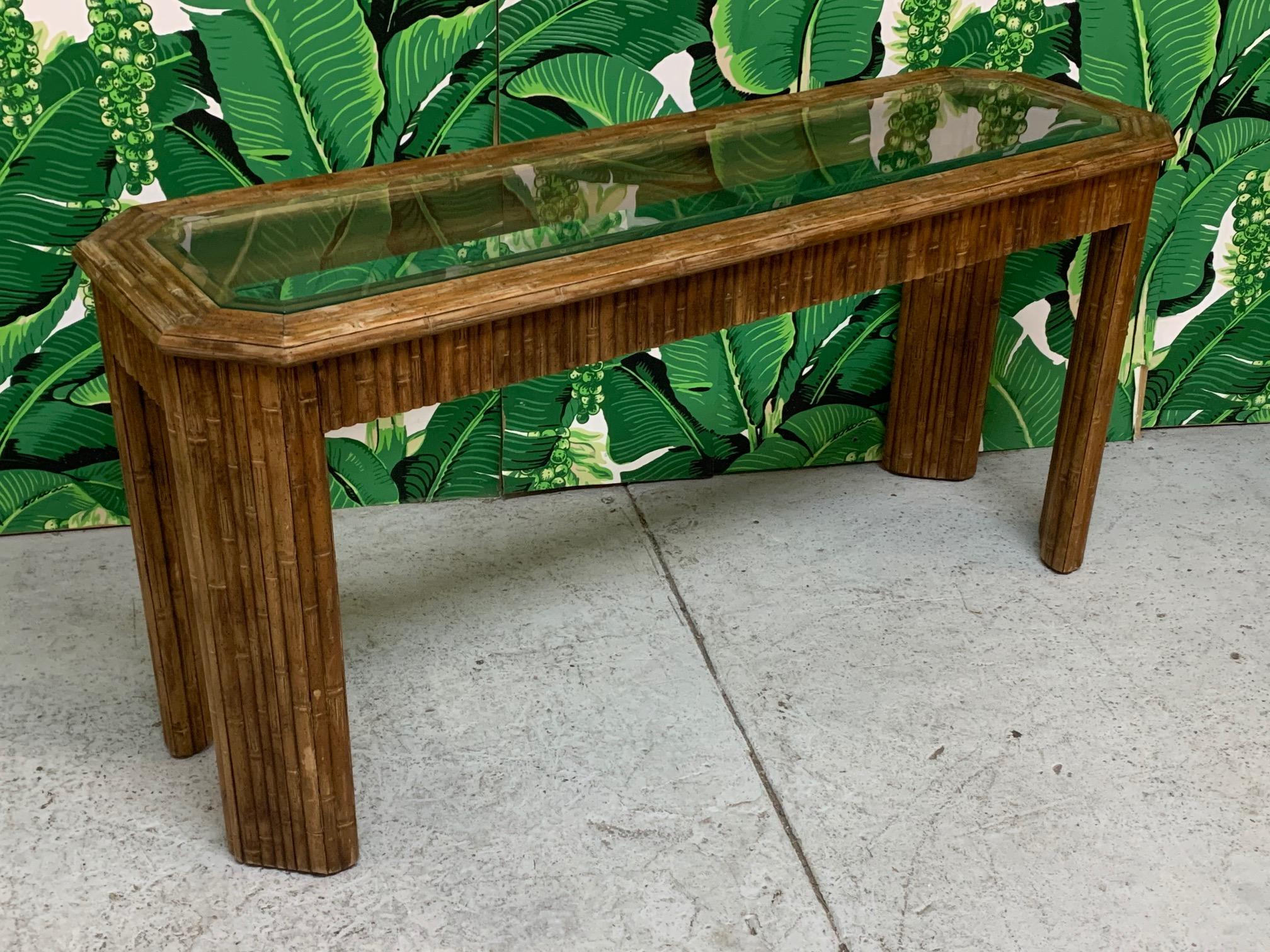 Vintage console table features full bamboo veneer and glass insert top. Good vintage condition with minor imperfections consistent with age.