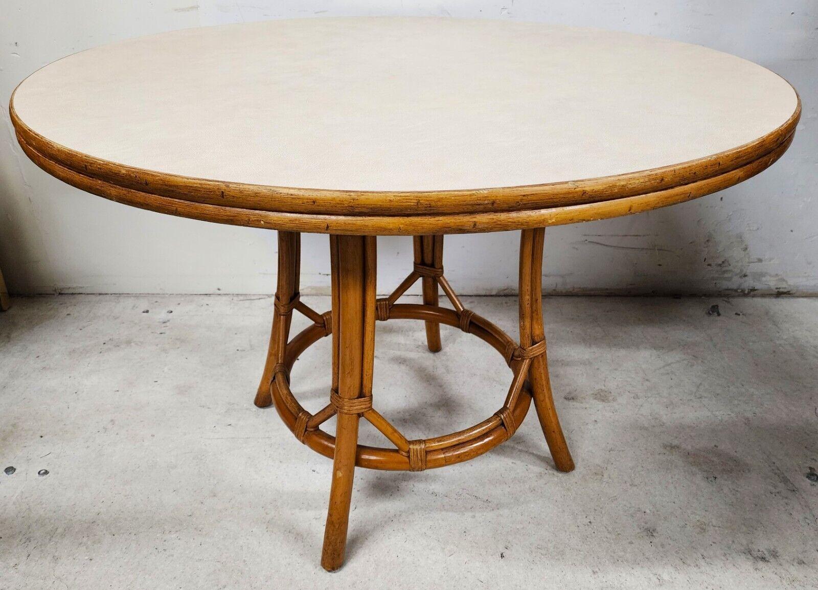 For FULL item description click on CONTINUE READING at the bottom of this page.

Offering One Of Our Recent Palm Beach Estate Fine Furniture Acquisitions Of A Vintage Bamboo Rattan Old Florida Boho Style Dining Table 
With a Mica top which is almost