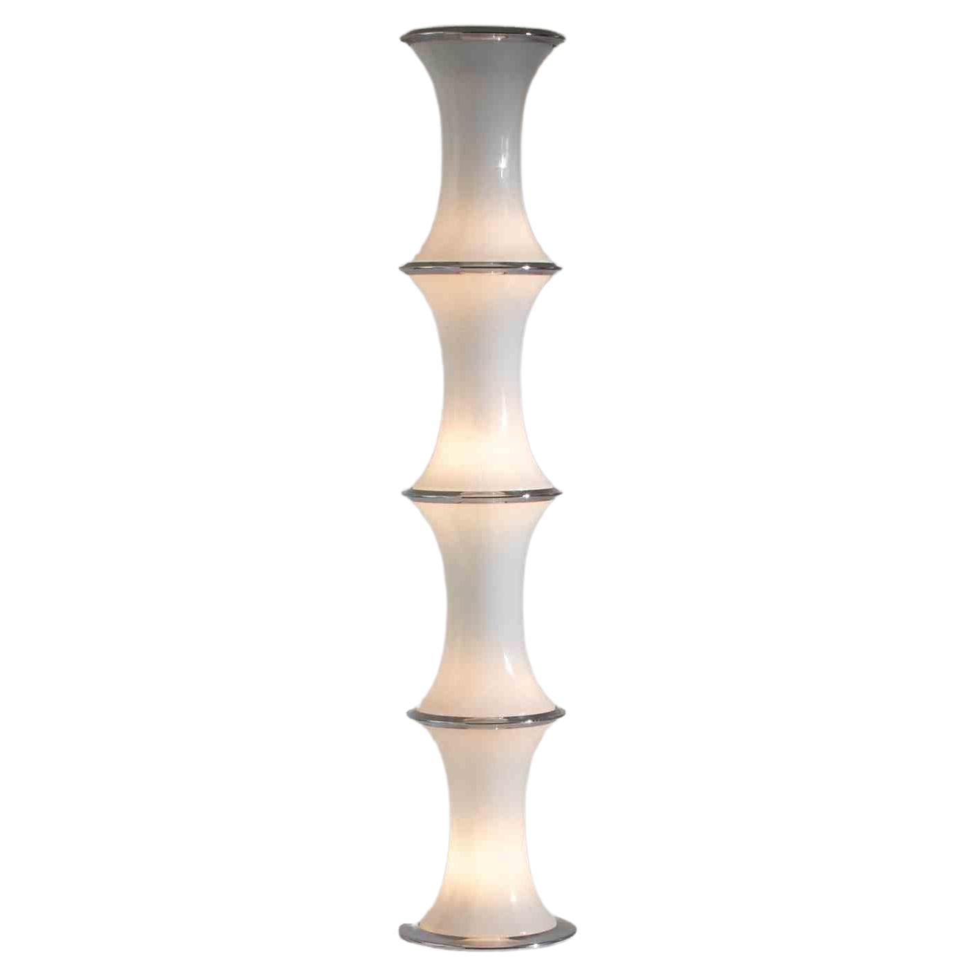 Bamboo Floor Lamp  is an elegant floor lamp realized by  the Italian designer  Enrico Tronconi for Vistosi in the 1960s.

Very beautiful decorative lamps with a Murano glass body.

Opaline Glass and Chromed Metal.  H 173 cm.

Very Good condition!

 