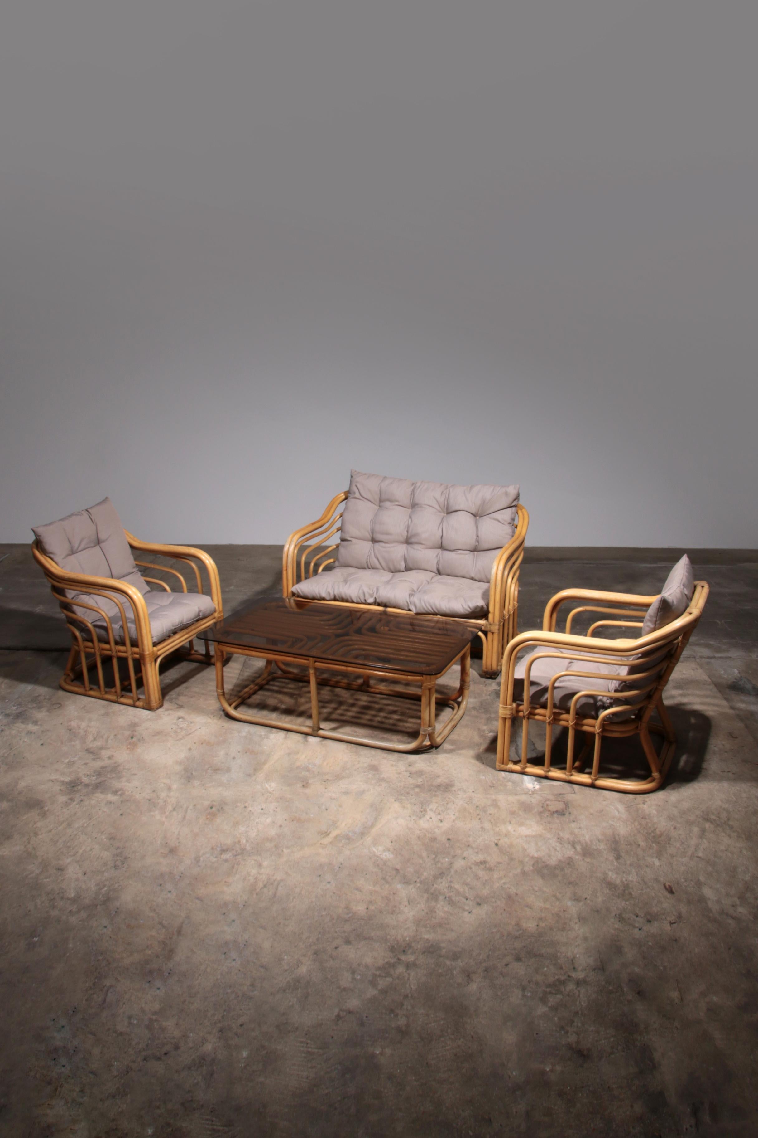 

Elevate your living space with this exquisite Vintage Bamboo Furniture Set, featuring a cozy two-seater sofa, two elegant armchairs, and a chic coffee table with a smoked glass tabletop. Crafted from high-quality bamboo, each piece showcases a