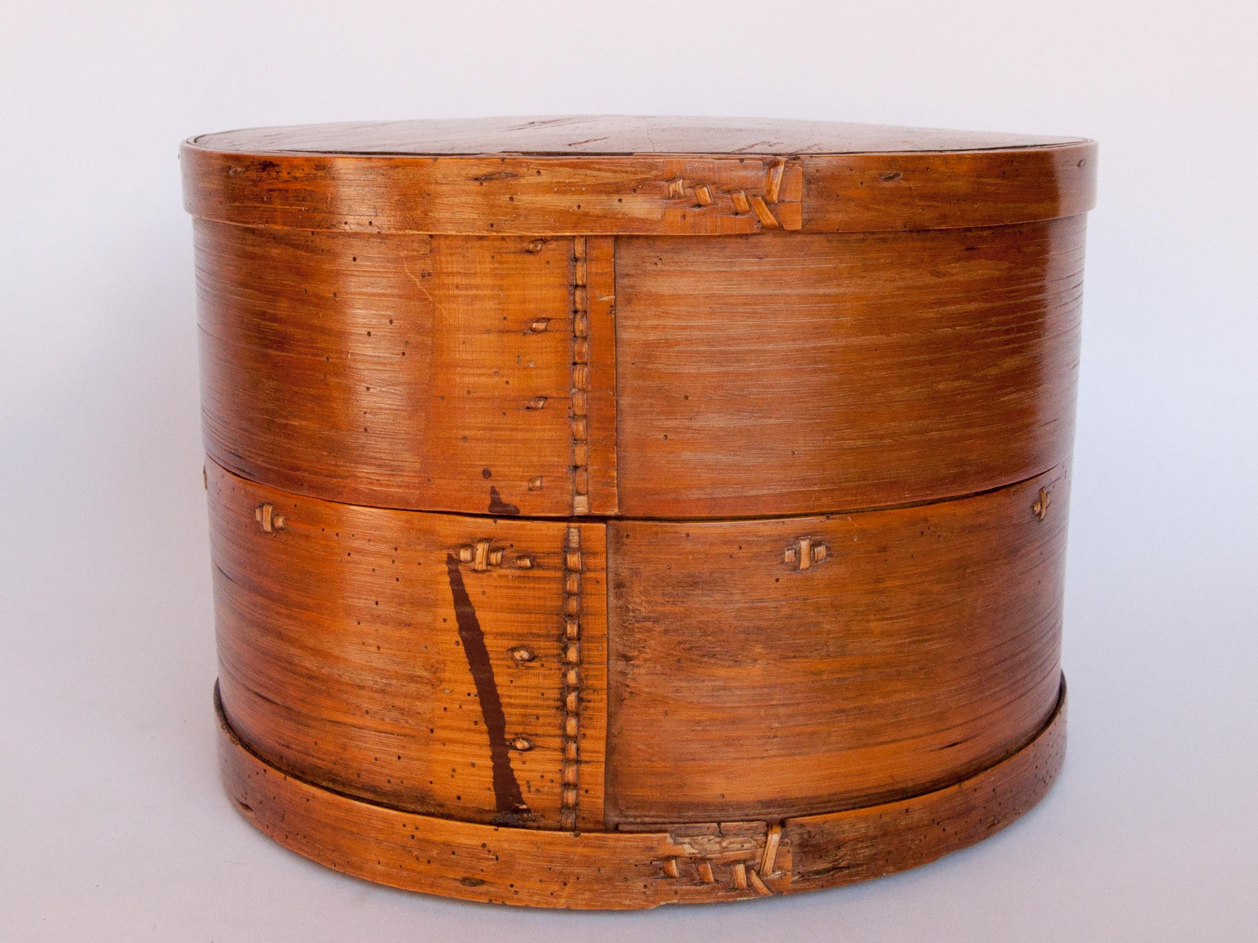 Vintage bamboo kitchen box from Bhutan, mid-20th century.
This container, made from bamboo, was used to store kitchen and food items in a traditional Bhutanese home.
Condition: This is an old box which has seen many years of household service, and