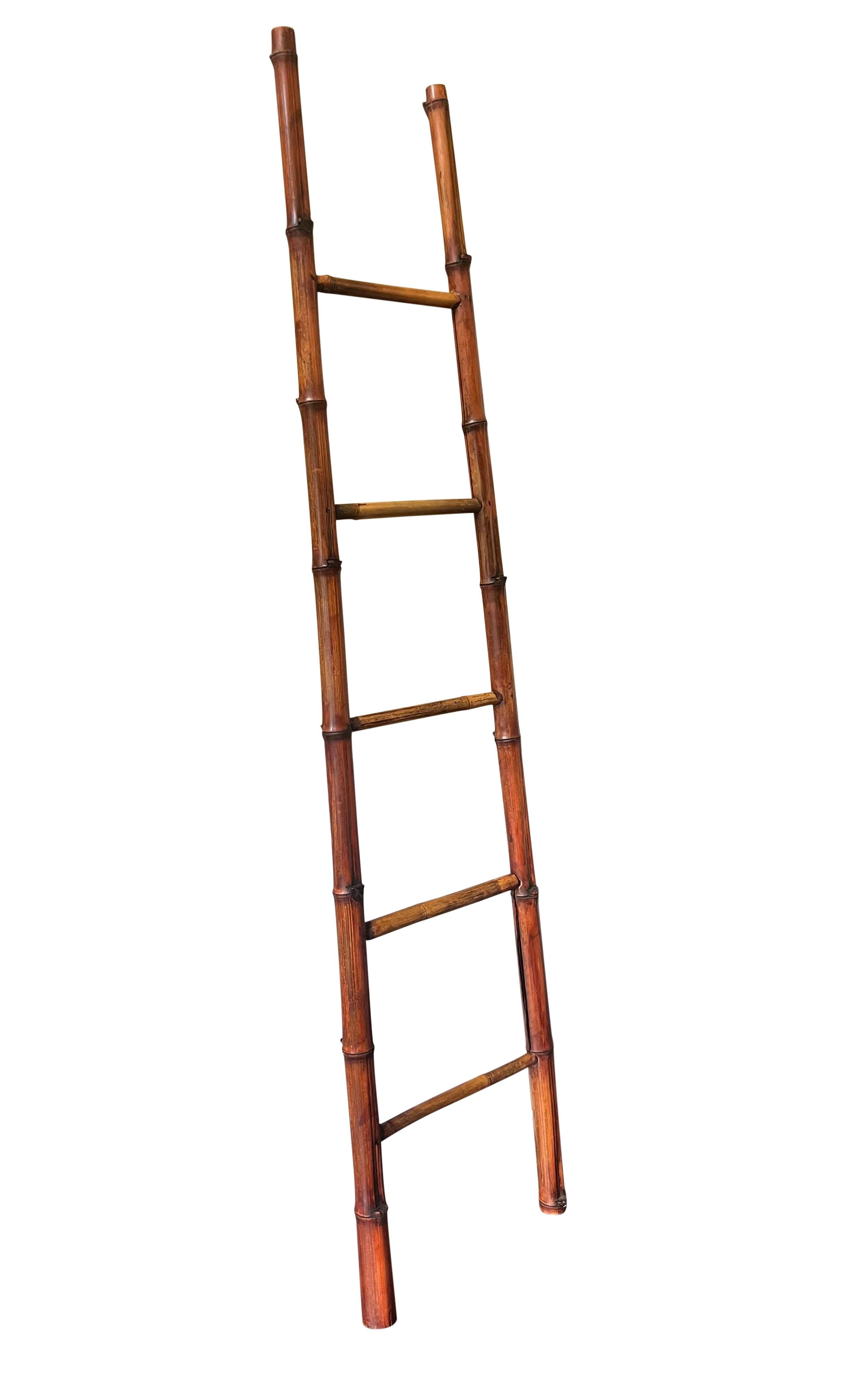Vintage bamboo ladder, circa 1950's.

Beautiful ladder crafted of sturdy bamboo with a subtly tapered A frame. A simple design and nice patina. Sure to bring lots of character and rustic elegance to any room using minimal space. Great for displaying