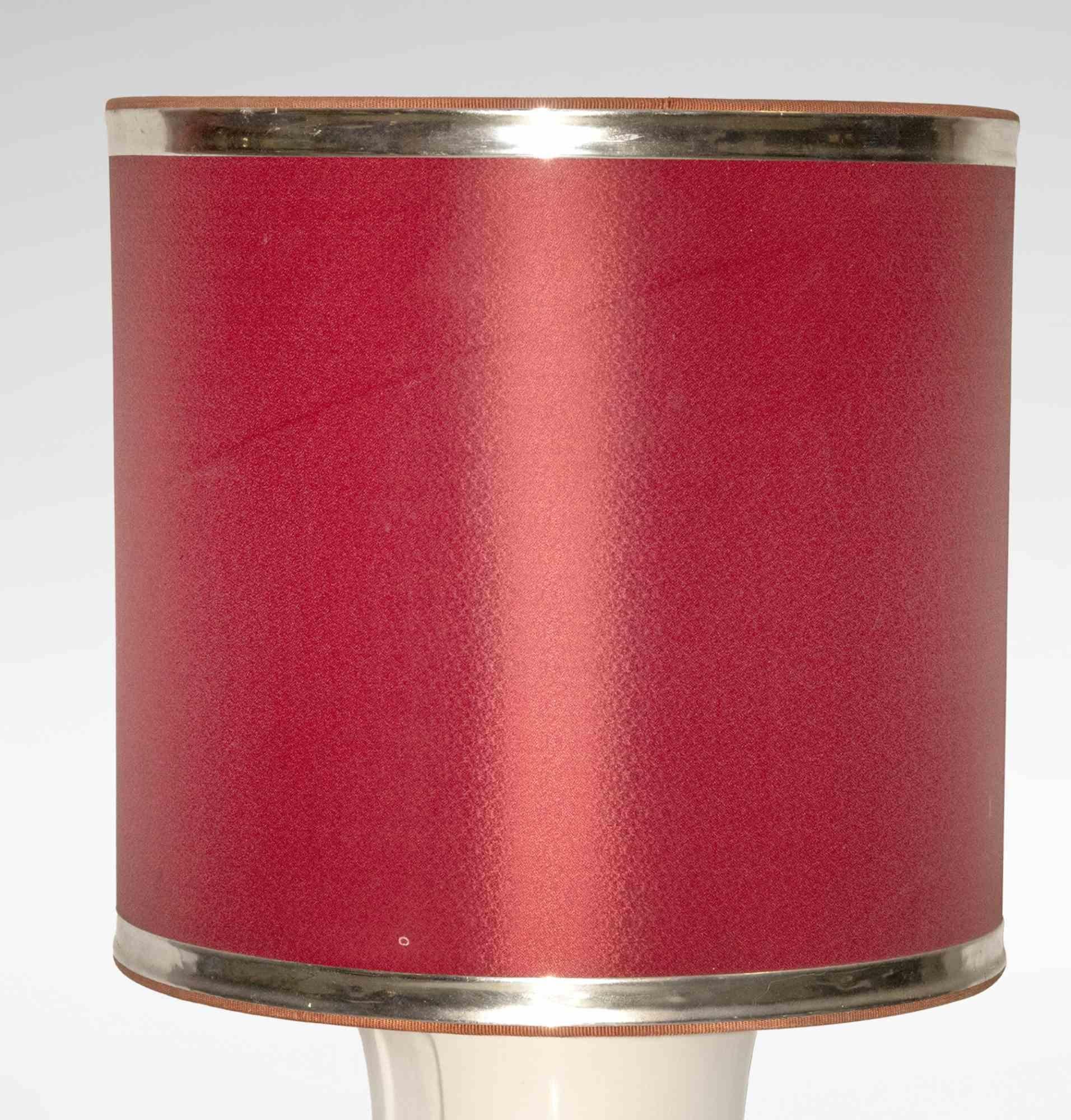 Vintage bamboo lamp is an original design lamp realized in the 1970s.

A vintage lamp in ceramic and brass with a red fabric lampshade.

Don't miss this opportunity.