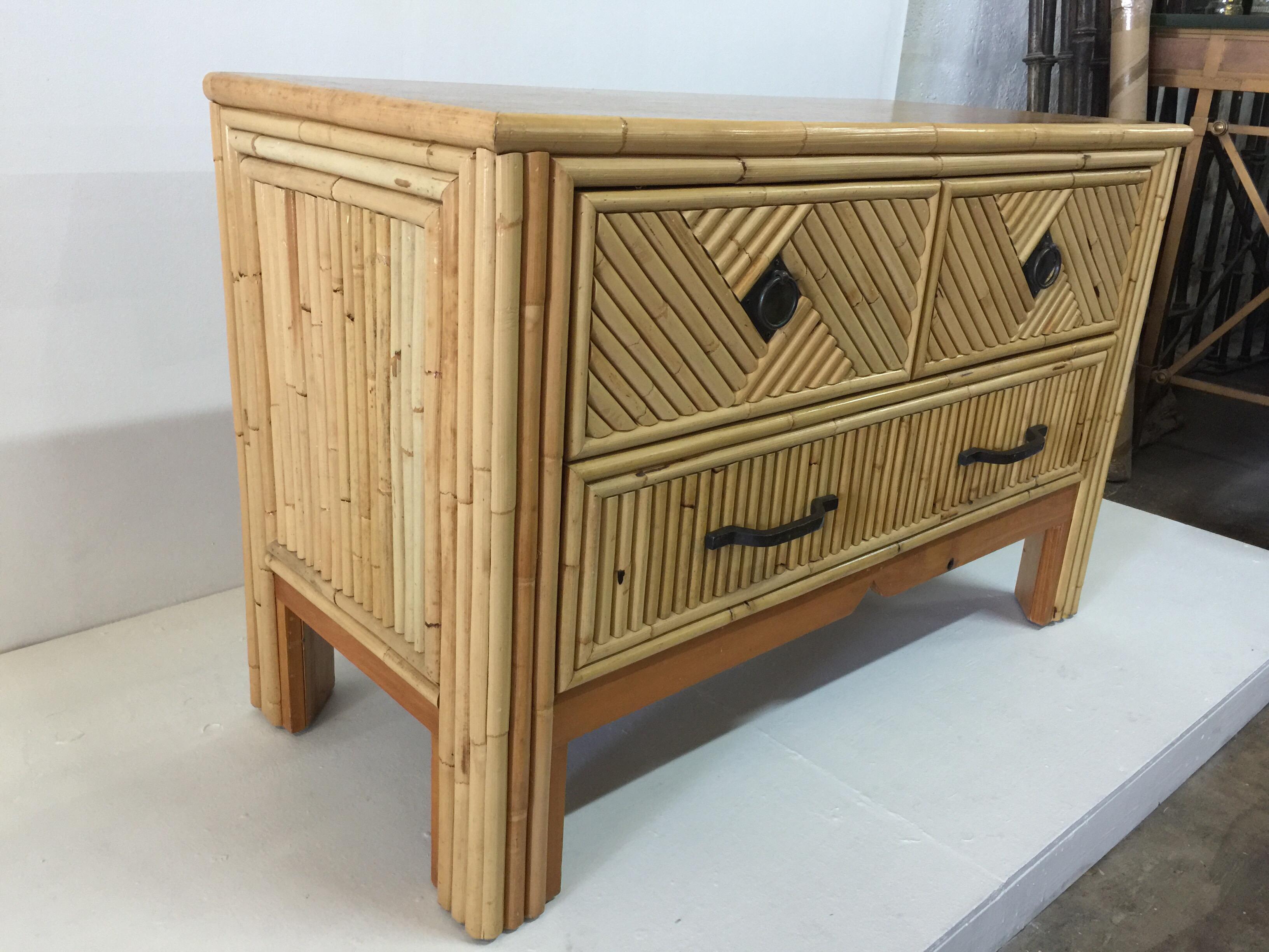 Beautiful bamboo in geometrical pattern commode/cabinet with three drawers with original dark bronzed metal hardware.