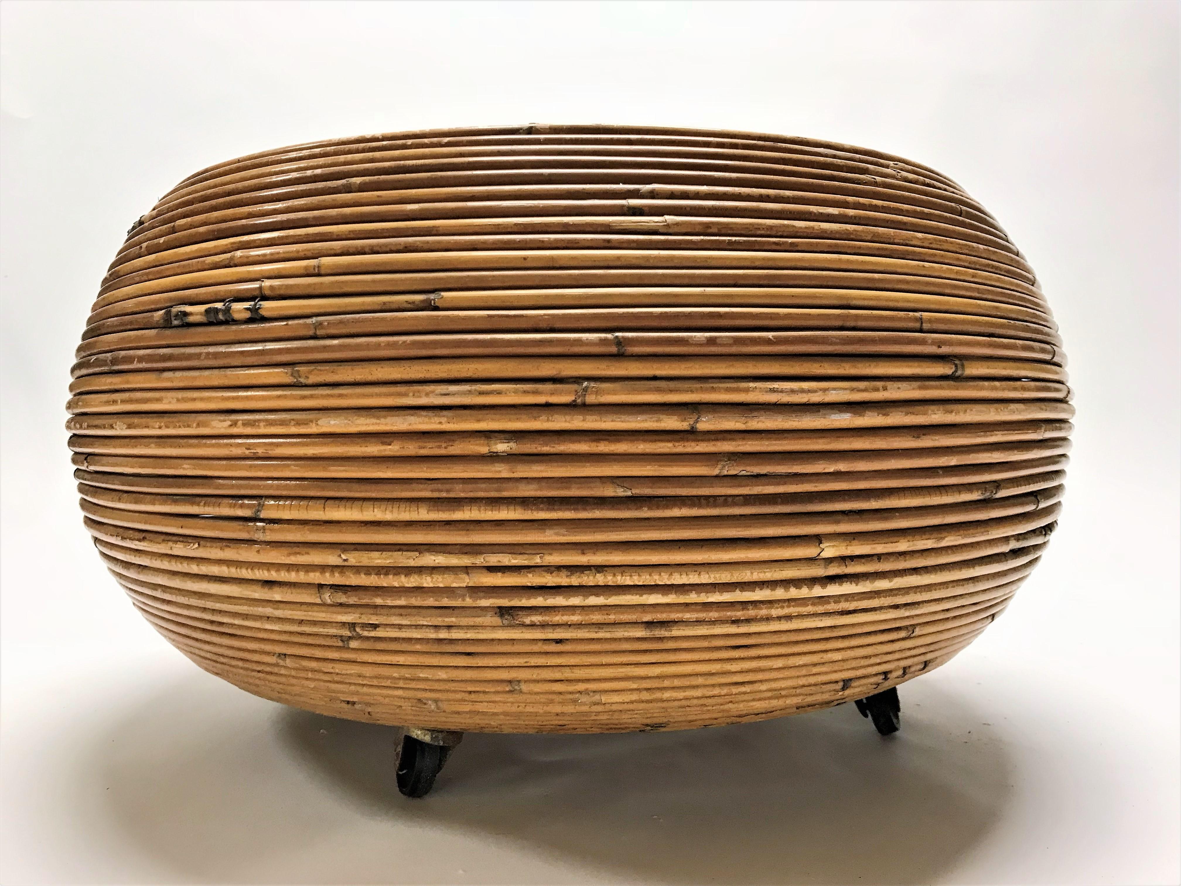 Pair of bamboo planters or baskets on brass casters in the style of Gabrielle Crespi.

These organic and useful pair of baskets show a beautiful wear.

These baskets can be used to store blankets, toys, and are very decorative.

Sold as a