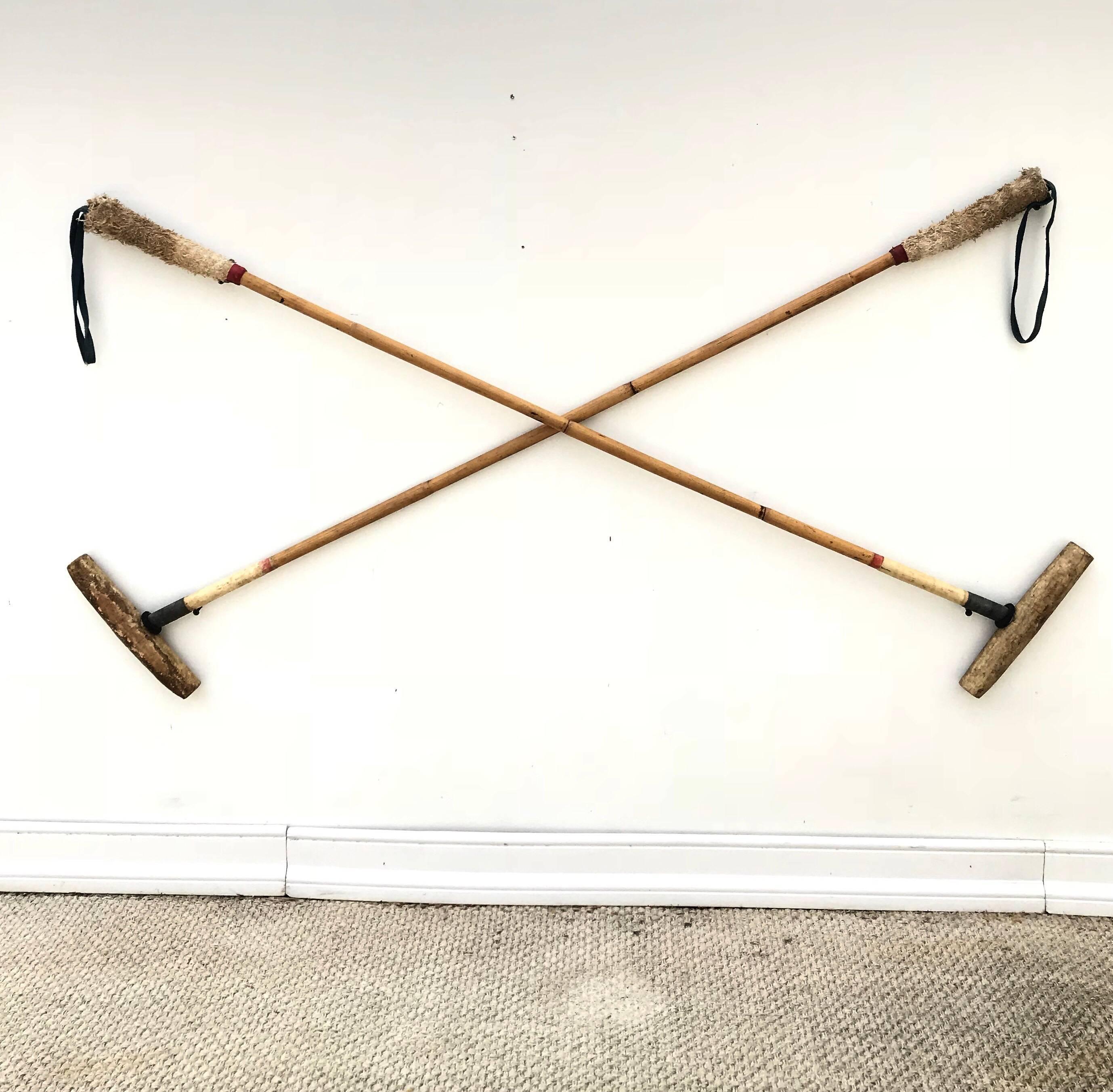 A fetching pair of well used bamboo polo mallets. A wonderful decorative objet for a sporting room.
