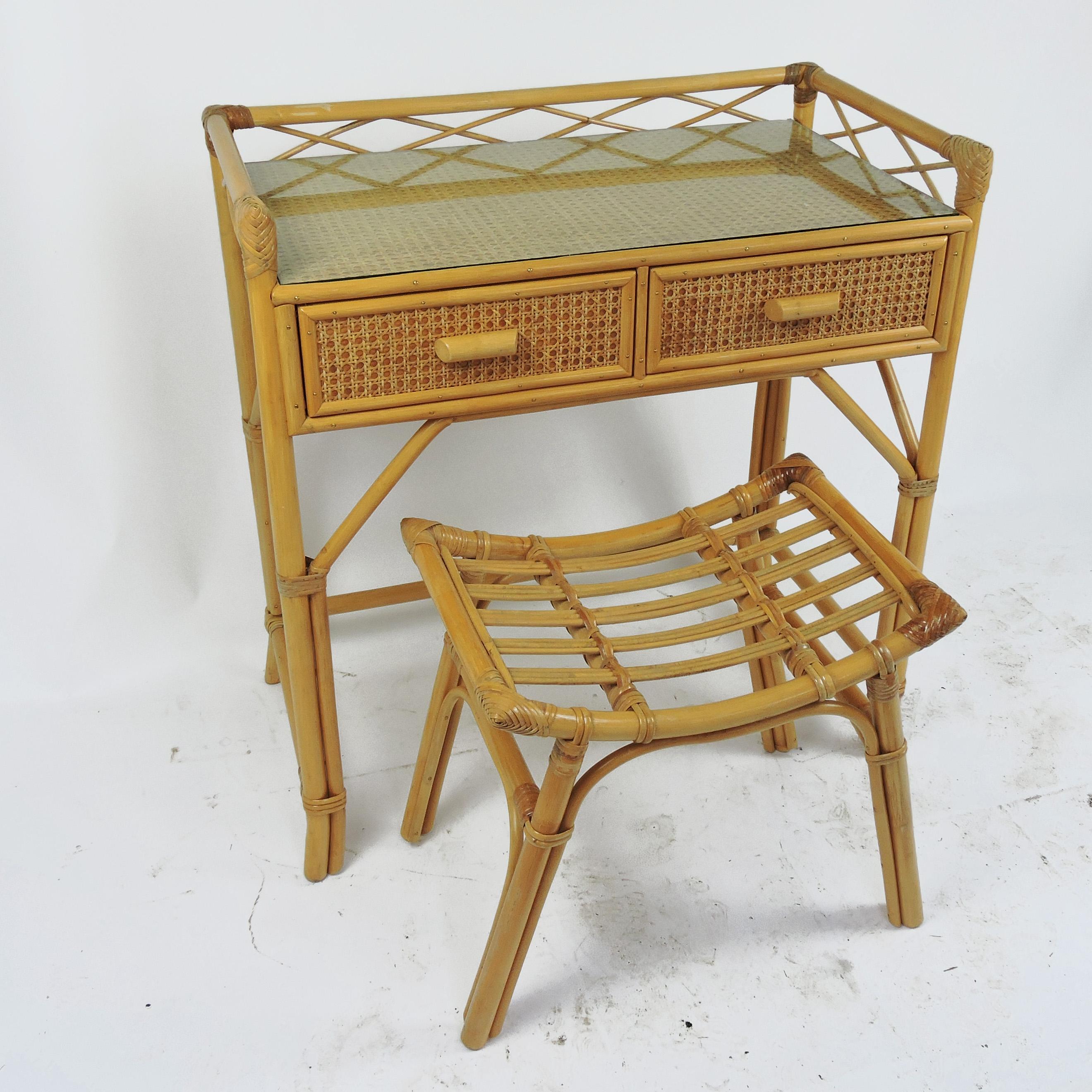 A bamboo and rattan dressing table with matching stool. It can also be used as a desk.