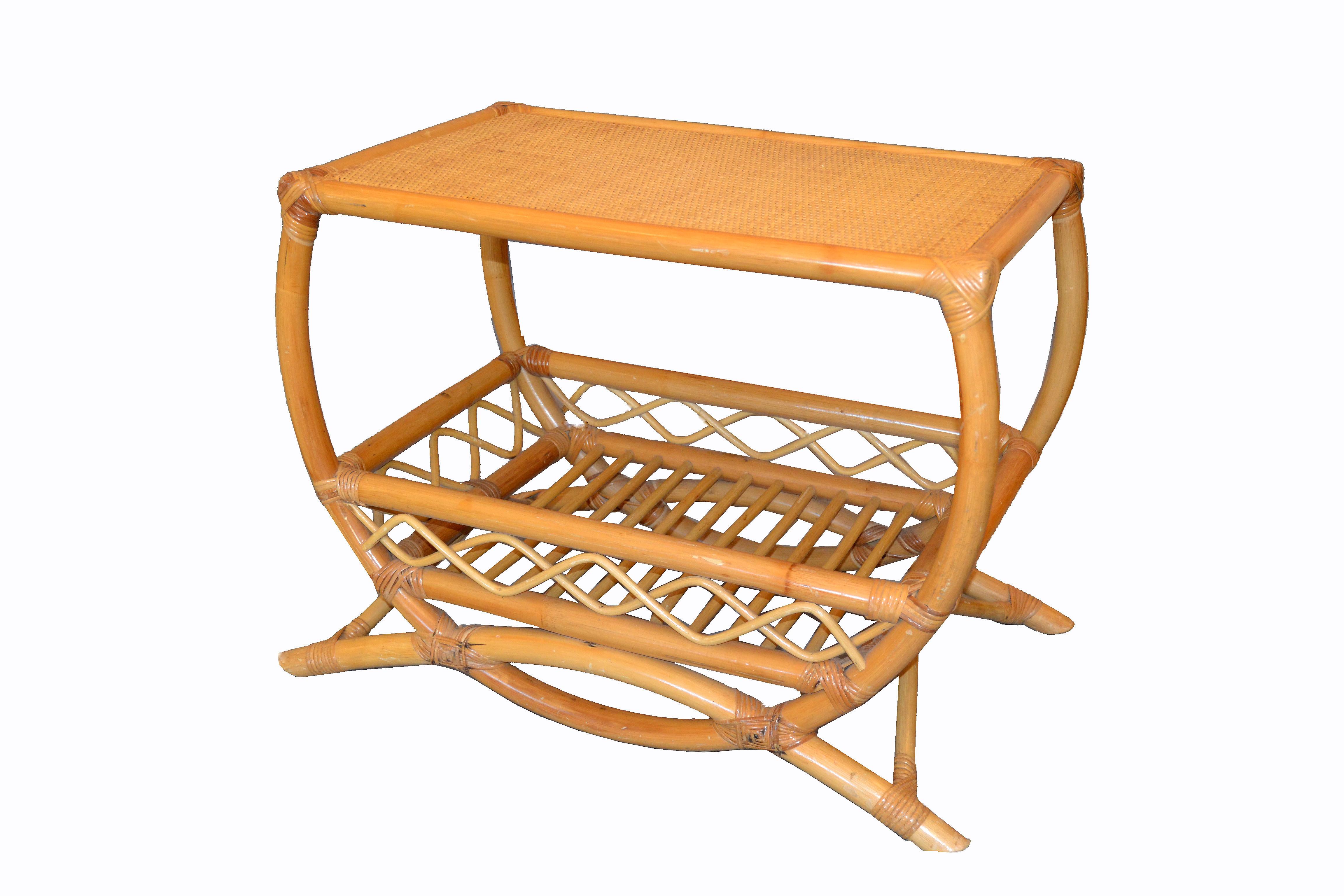 Vintage bamboo and rattan rectangular side table with a woven top, natural rattan frame, reed wrapped corners and lattice and bentwood design. Both ends are open.
Thick rattan dowels line the lower interior for additional storage space.
 