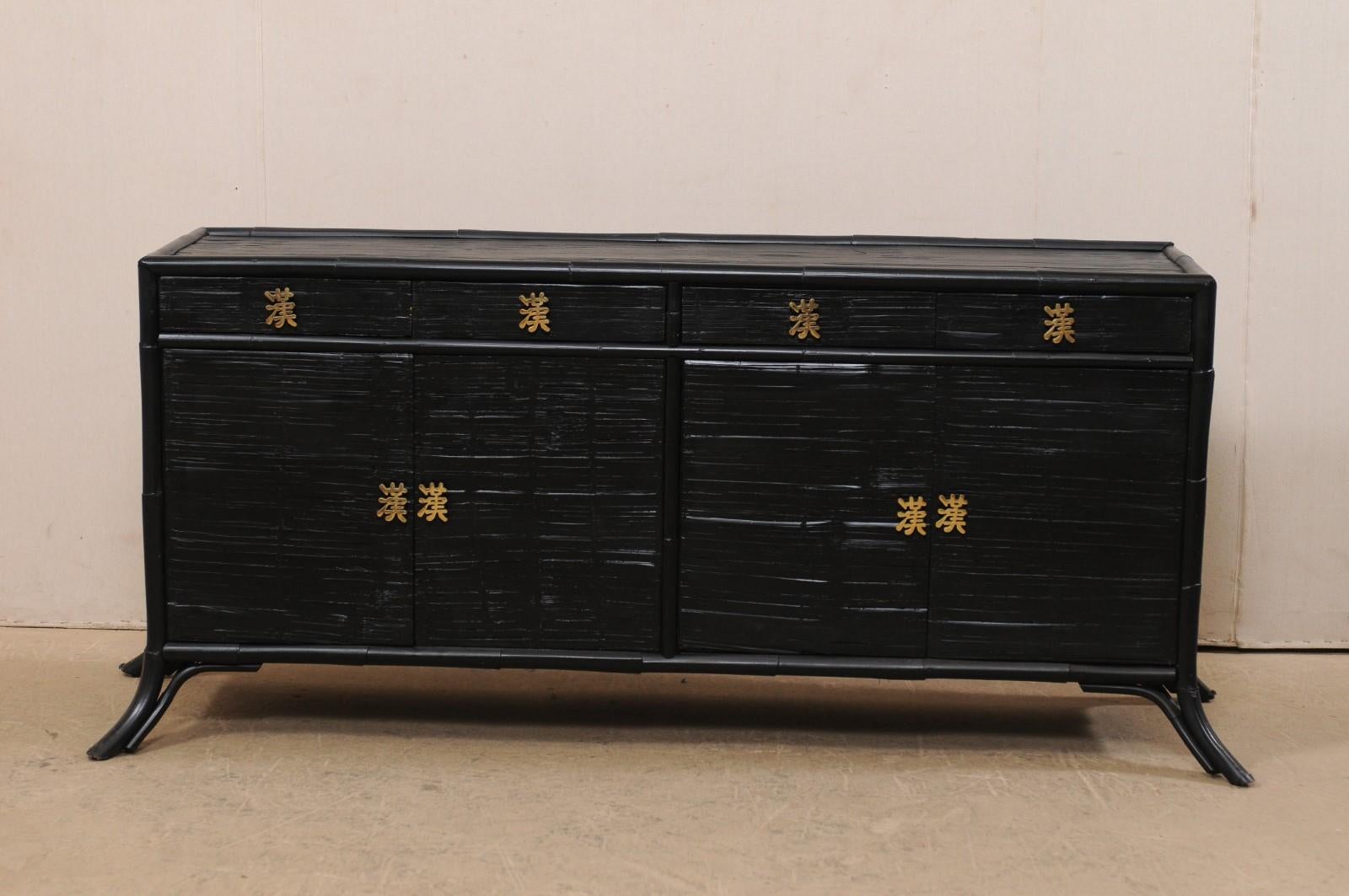 A vintage American painted bamboo reed buffet console. This American sideboard, inspired with modern design elements, is just over 6 feet in length, and features a rectangular-shaped case, with four small drawers just beneath it's top, and two pairs