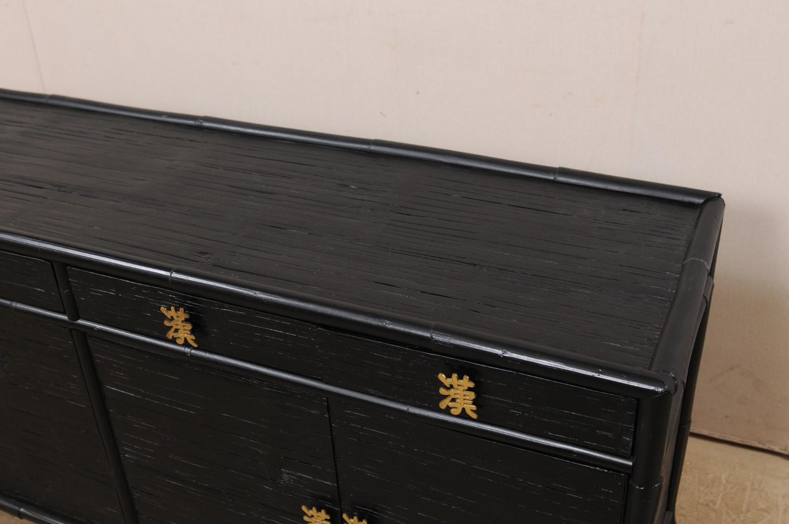 black sideboard with gold handles