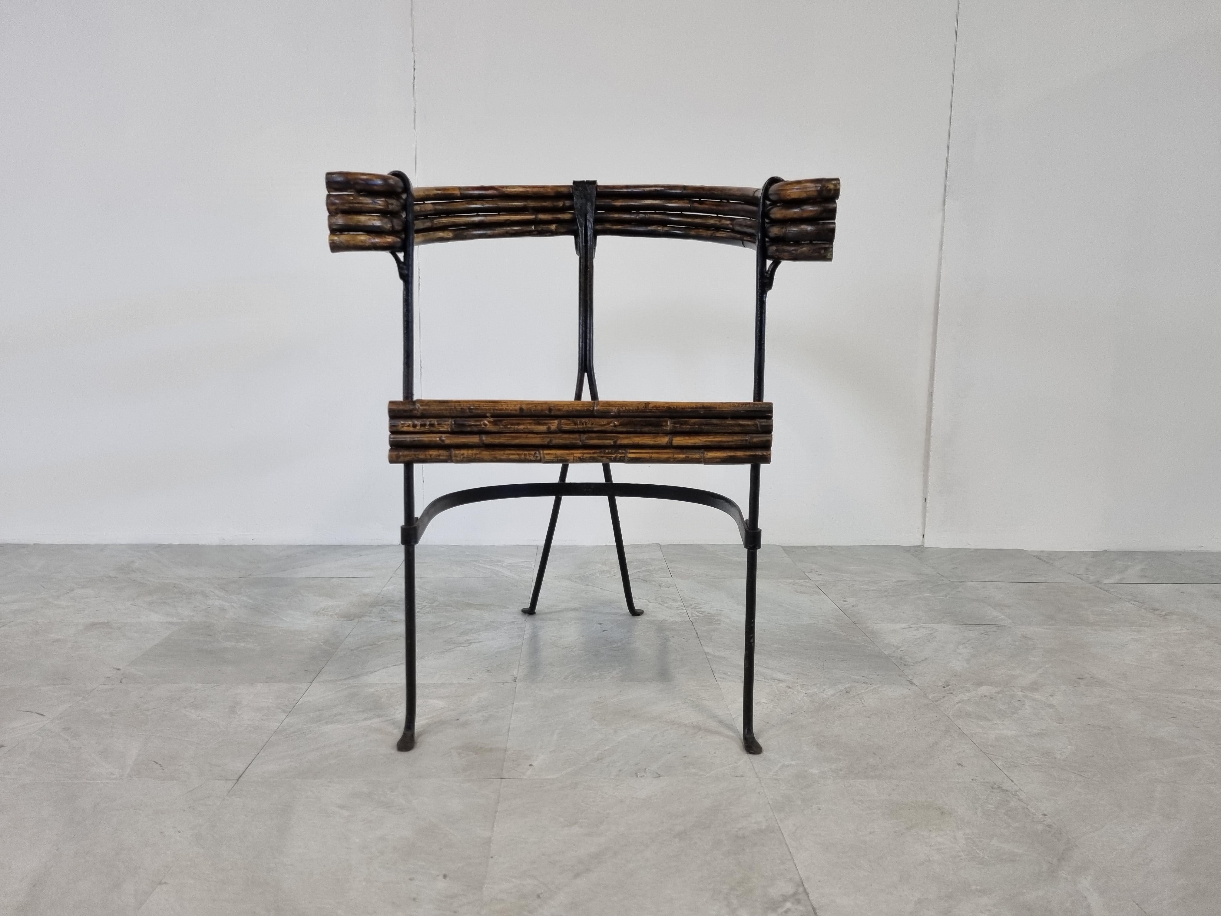 Exquisite bent bamboo and wrought iron side chair.

Very well made side chair with lovely patinated bamboo and a very nice sculpted wrought iron frame

1960s - France

Good condition

Height: 77cm/30.31