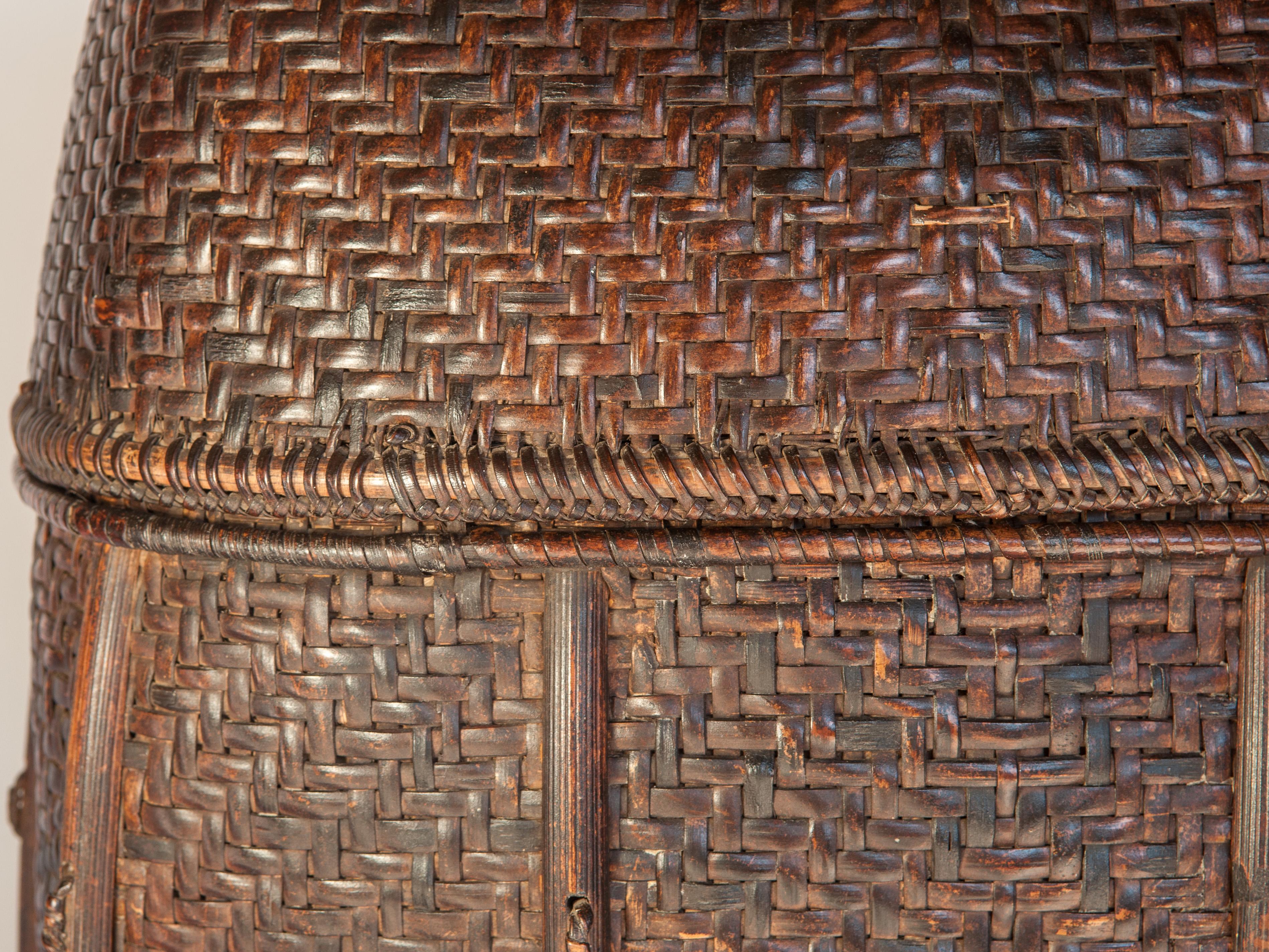 Vintage Bamboo Storage Basket from the Akha of North Thailand. Mid-20th Century.
Handwoven storage baskets such as these were (and are) used to store textiles or other household goods. This one is woven utilizing a robust double weave, and