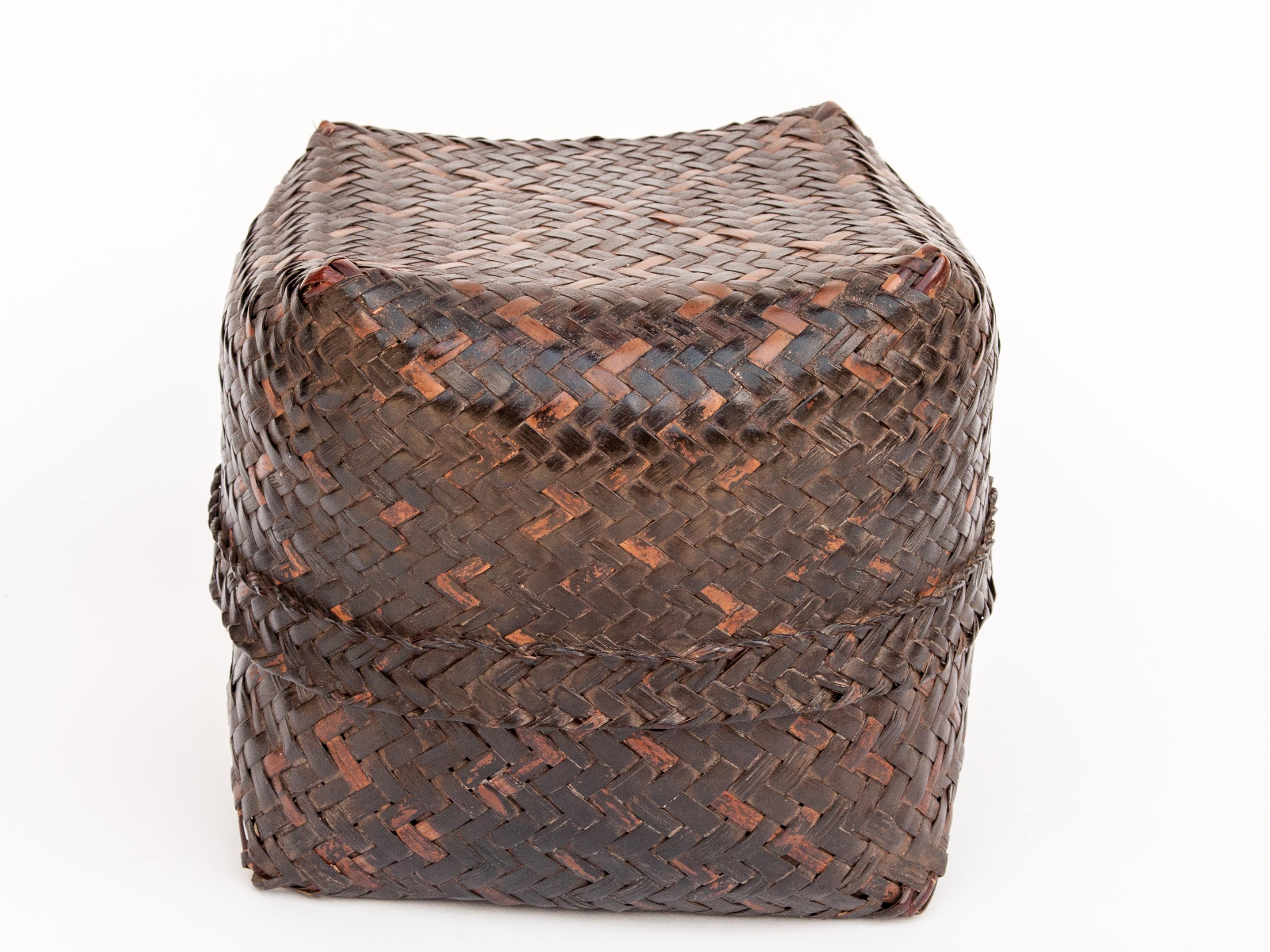 Vintage bamboo storage box basket with lid from Lombok, Indonesia, mid to late 20th century.
This sturdy bamboo basket was fashioned by hand and used to store household items and keepsakes. It is simply conceived and cleanly worked; and exhibits a