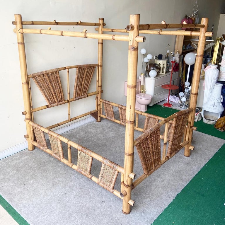 Exceptional vintage bamboo queen size canopy bed. Features a wicker woven headboard, side rails and footboard.
 