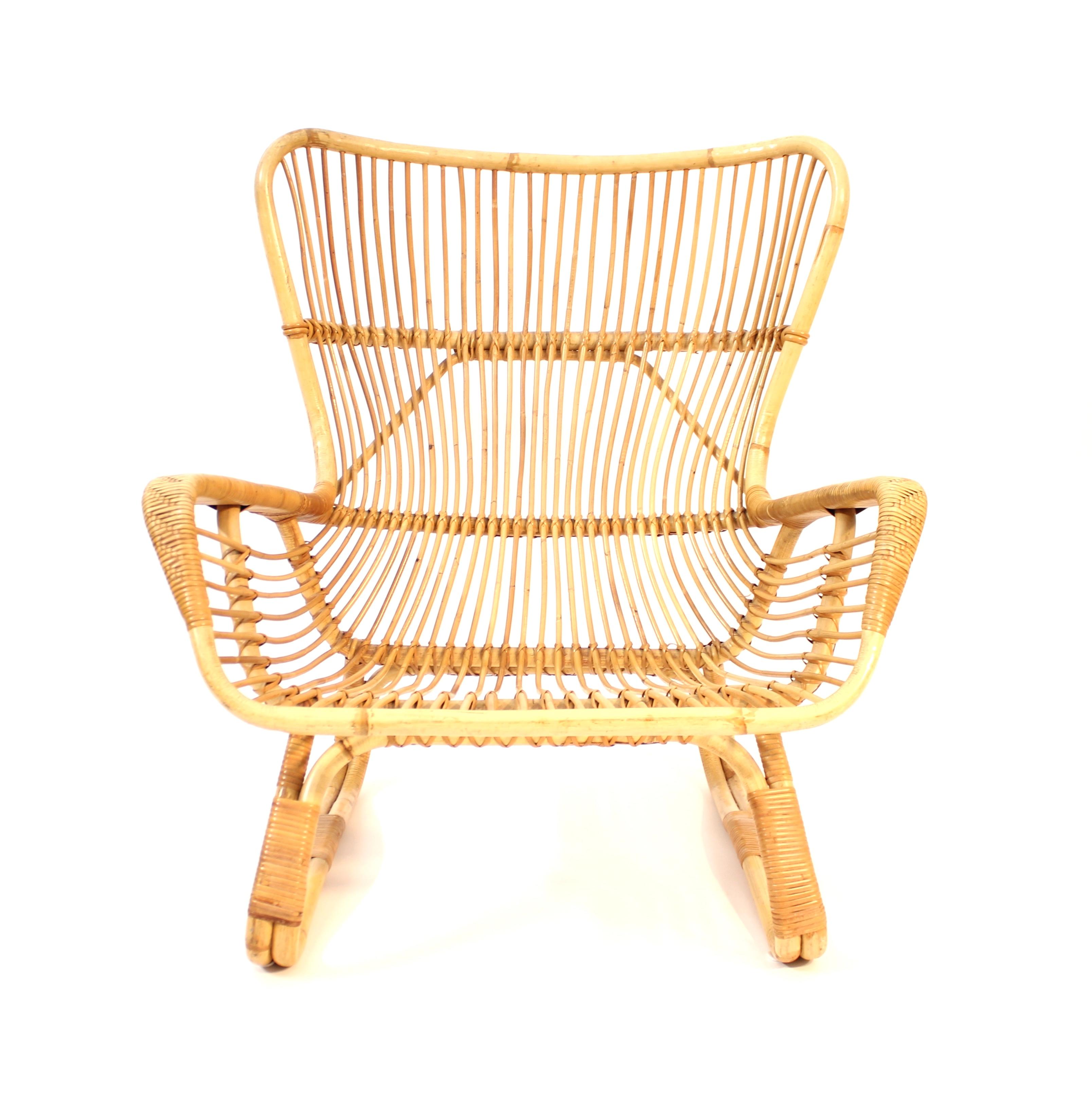 Large and cozy bambu and rattan chair from the mid-century. Rounded shapes of the whole frame. Unknown maker but feels very Italian in its shape and proportions. Very good untouched vintage condition with light ware consistent with age and use.