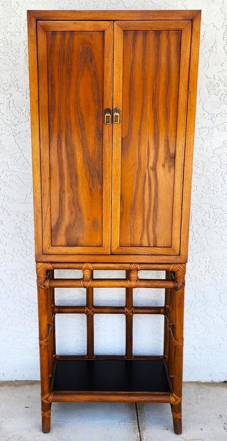 For FULL item description click on CONTINUE READING at the bottom of this page.

Offering One Of Our Recent Palm Beach Estate Fine Furniture Acquisitions Of A
Vintage 1970s Bamboo Rattan Boho MCM Bar Cabinet 
Base is bamboo and rattan. Top