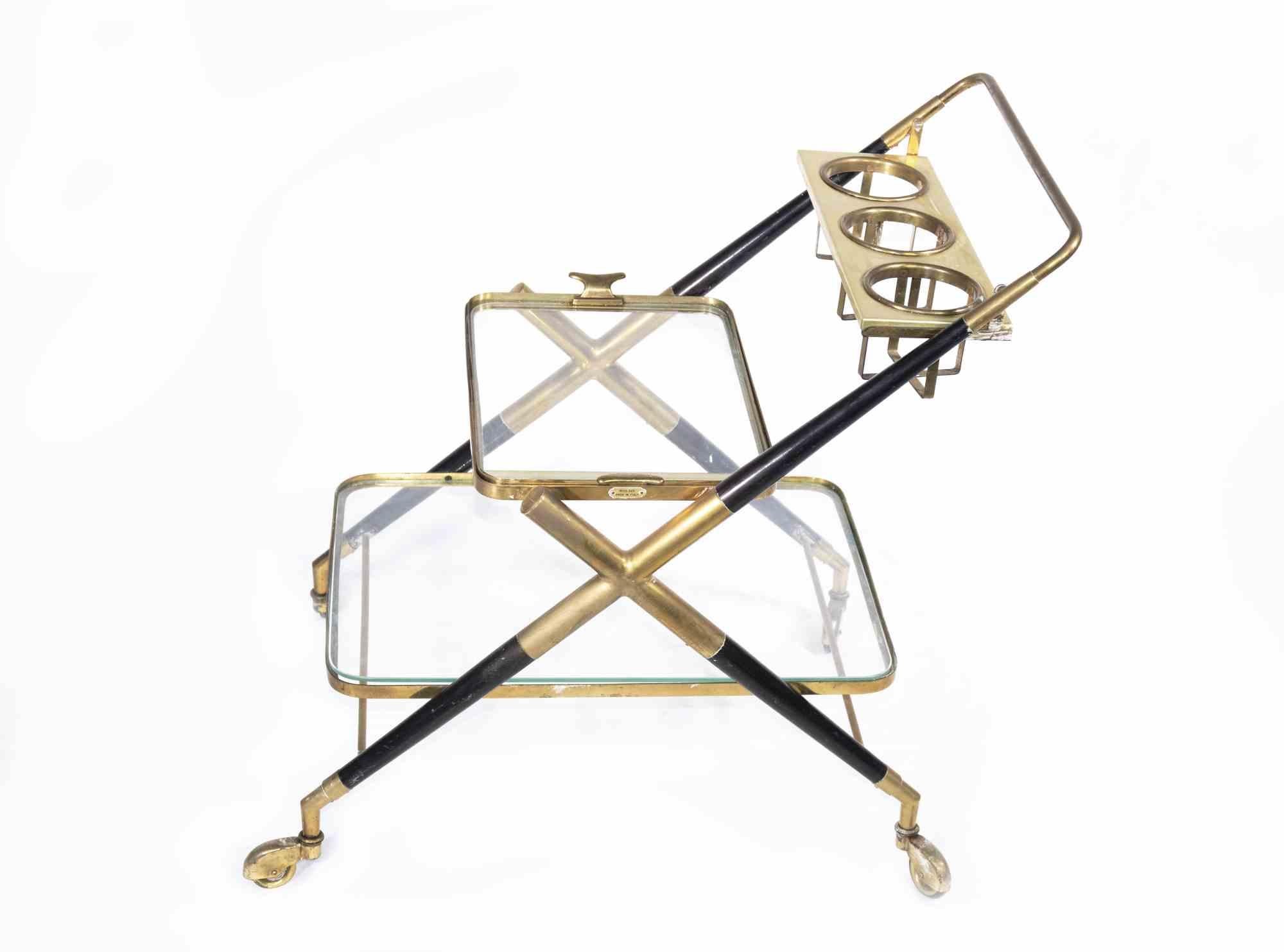 Vintage bar cart is an original design item attributed to the Italian designer Cesare Lacca in the 1970s.

A black and brass bar cart with shelves glass. 

Mint condition.

Serve your drinks and food on this vintage cart!