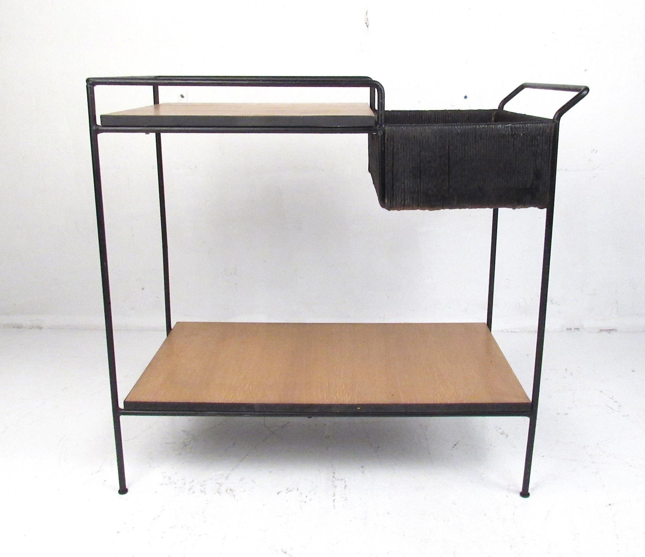 Classic bar cart by Arthur Umanoff iron frame with rush trim, circa 1950. Restoration recommended.
Please confirm item location (NY or NJ).