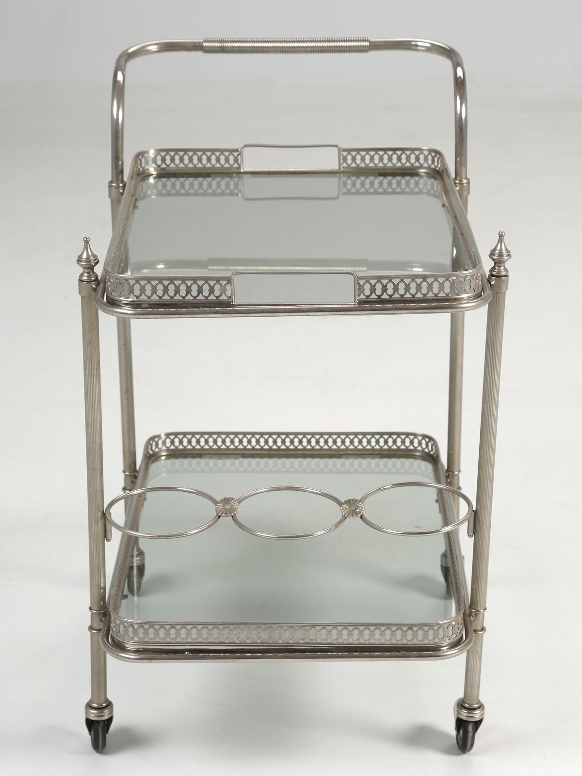 Vintage Mid-Century Modern bar cart imported from France. Our vintage French bar cart or some might try to refer to it was a tea cart, was probably made in the 1950's from chrome plated steel and does show some wear, but nothing stands out when you