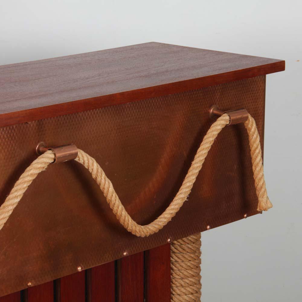 This vintage bar is in the tasteful style of designers Adrien Audoux and Frida Minet. It dates from the 1960s. The furniture is in wood, rope and brass. It is available with 2 matching stools. They measure 78 cm in height and the seat 30 cm in