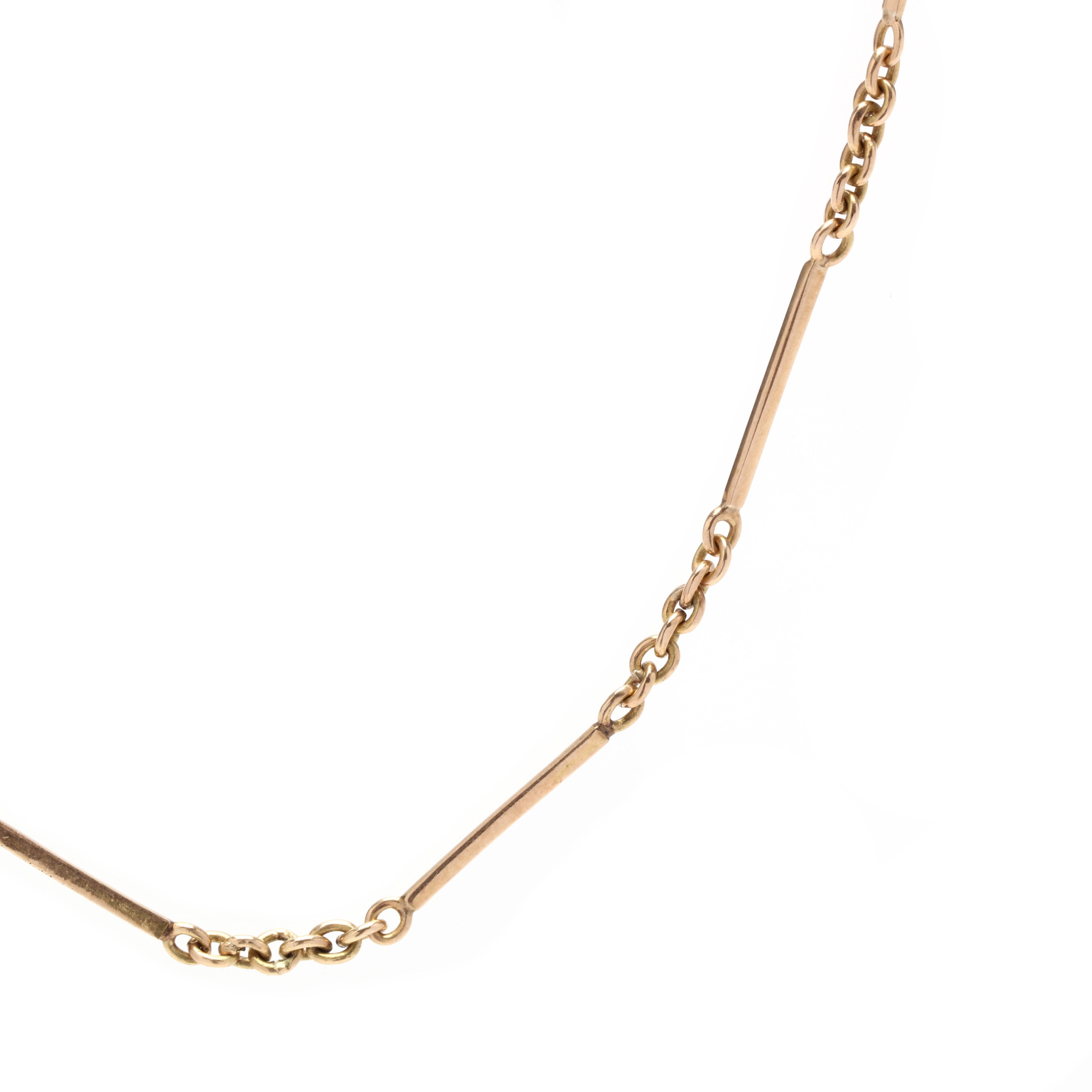 Ein Vintage 18 Karat Gelbgold bar Gliederkette. Diese dünne Anhängerkette weist ein abwechselndes Muster aus dünnen polierten Stäben und runden Gliedern mit einem Haken- und Ösenverschluss mit Achterverschluss auf.

Länge: 20,75 Zoll.

Breite: 1,4