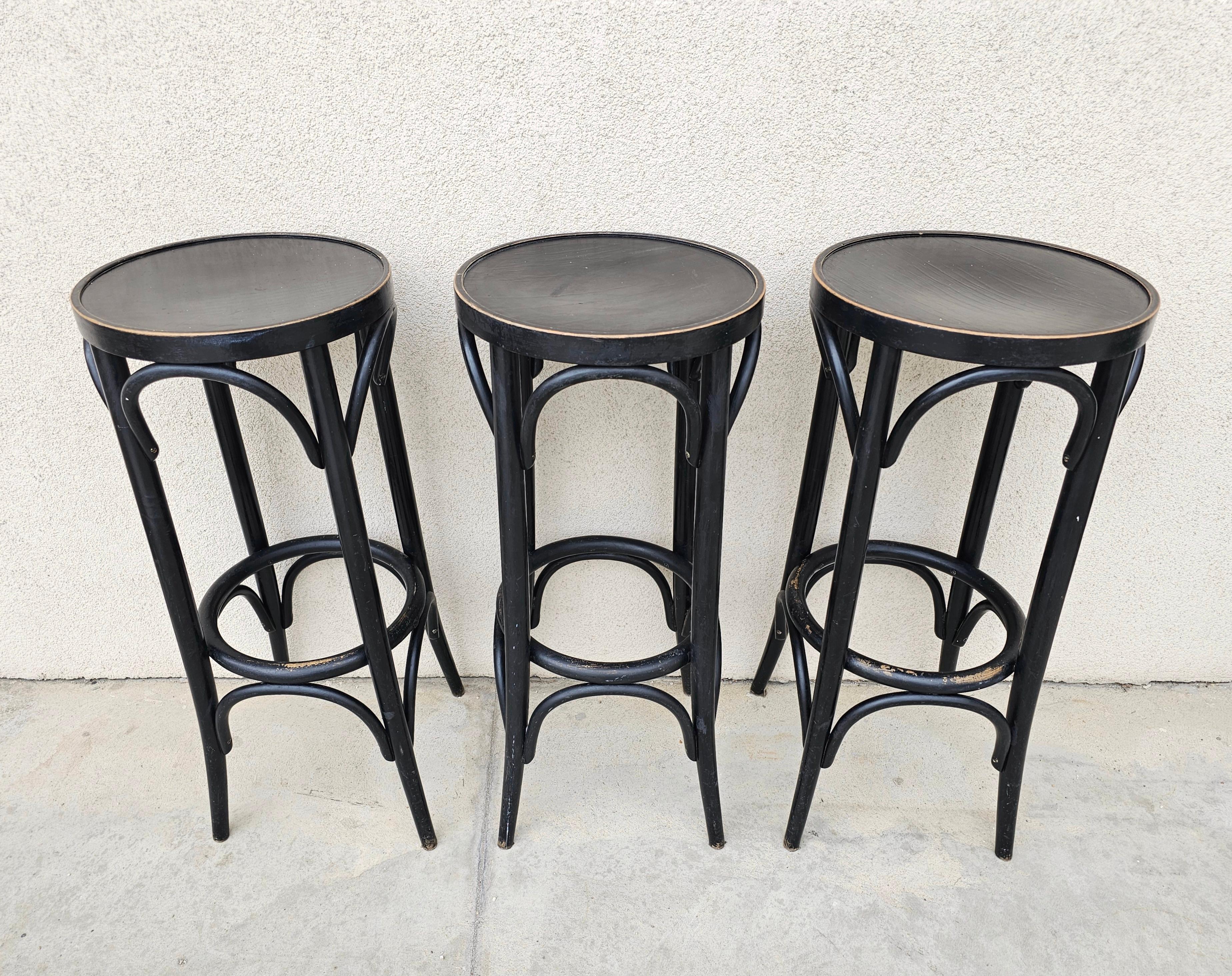 In this listing you will find vintage bar stools done in Beech Bentwood, manufactured by Mundus. Chairs are painted in dark brown, nearly black colour. Made in Yugoslavia in 1970s.

Bar stools are in good vintage condition with some signs of time