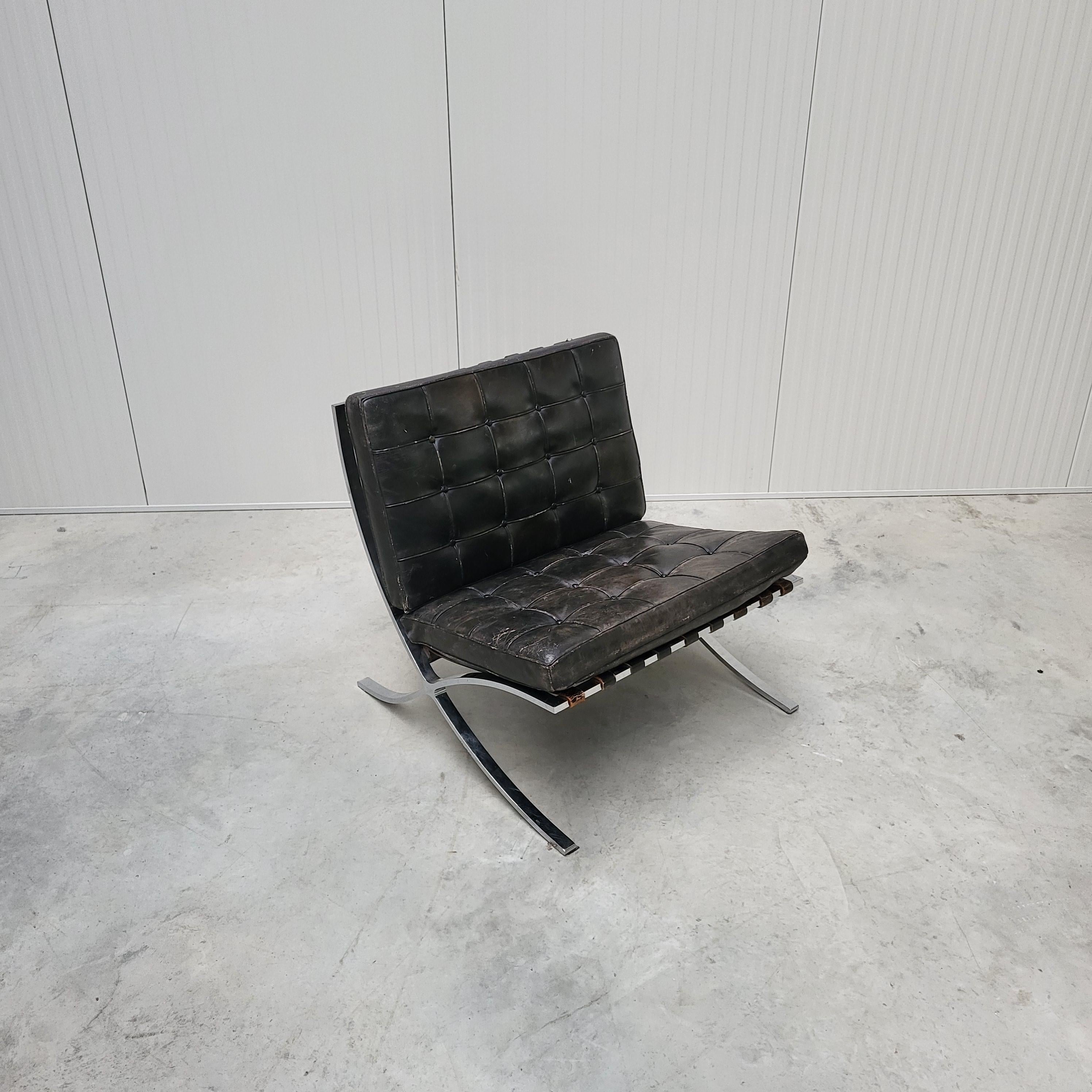 This rare Barcelona chair was designed by Mies van der Rohe in 1929 and produced by Knoll in the 1960s. 

The piece features an amazing hand dyed black leather upholstery with on a chromed steel base. 

The Barcelona chair is in a vintage condition.