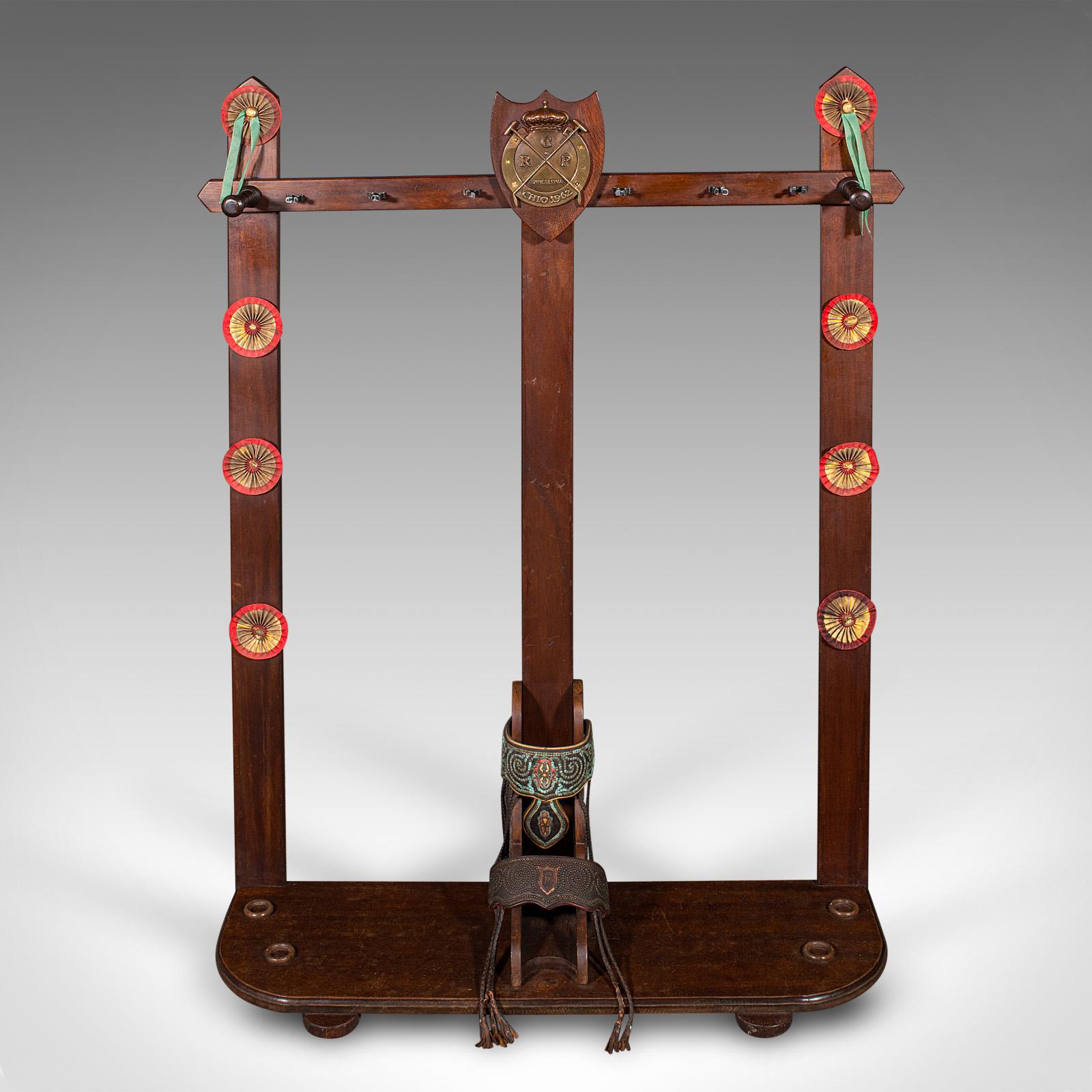 This is a vintage Barcelona polo mallet stand. A Spanish, oak equestrian tack or coat rack, dating to the mid 20th century, circa 1960.

Fascinating stand for polo enthusiasts, or as an accoutrement to a stable reception
Displays a desirable aged