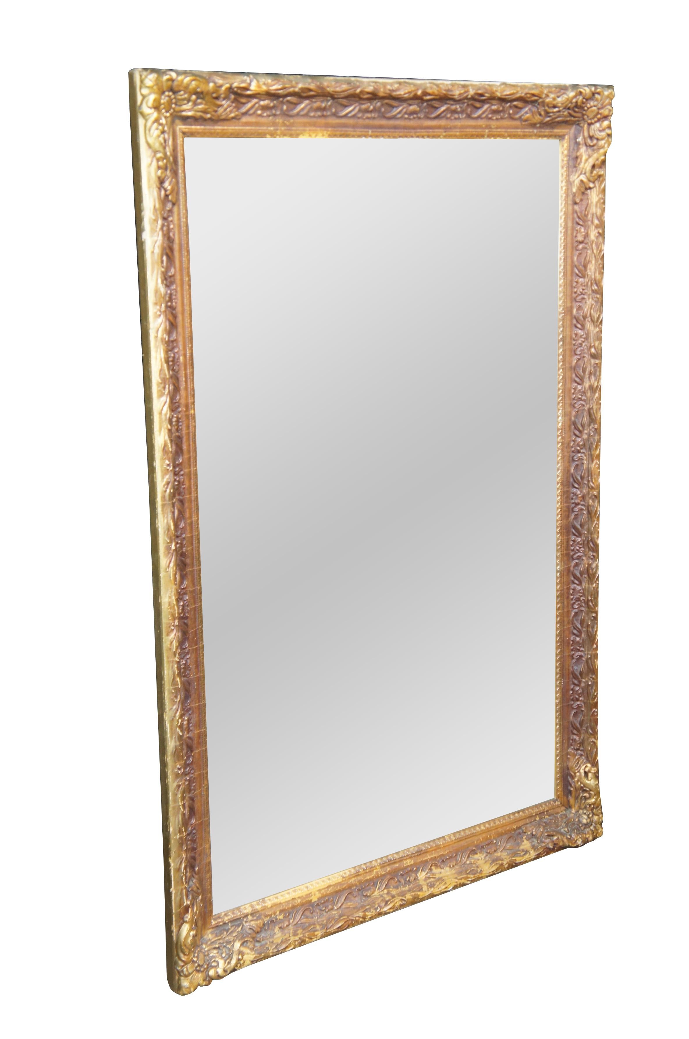 Vintage gold baroque mirror featuring rectangular form with low relief floral frame.

DIMENSIONS
26.5