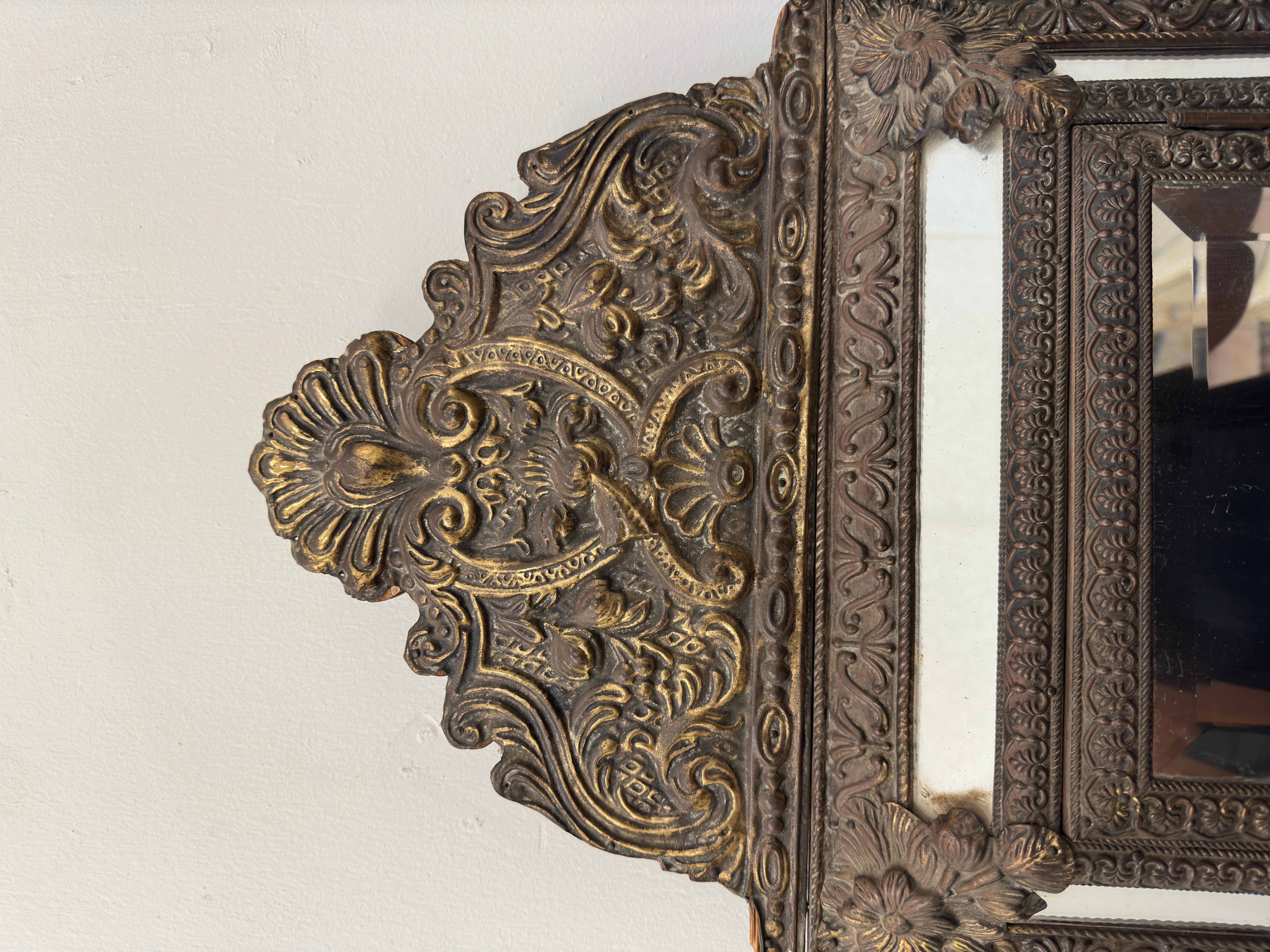 The Vintage Baroque Style Embossed Brass Mirror Cabinet is a stunning piece of furniture that exudes opulence and elegance. Crafted in the ornate Baroque style, the cabinet features intricate embossed brass detailing that adds a touch of grandeur to