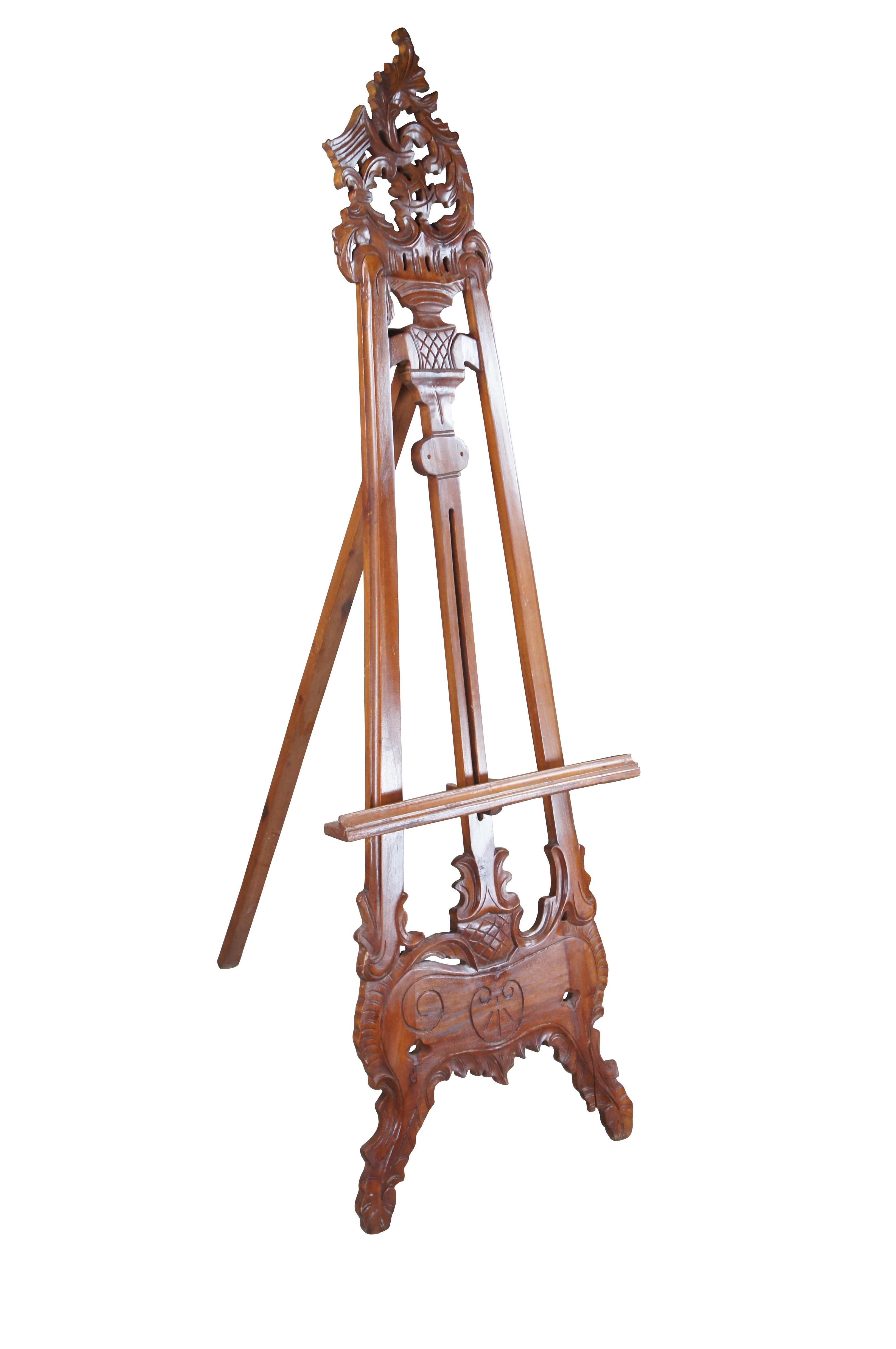 Late 20th Century Baroque inspired easel. Made from mahogany with pierced and carved foliate. Features an adjustable stand for displaying artwork.

Dimensions:
67