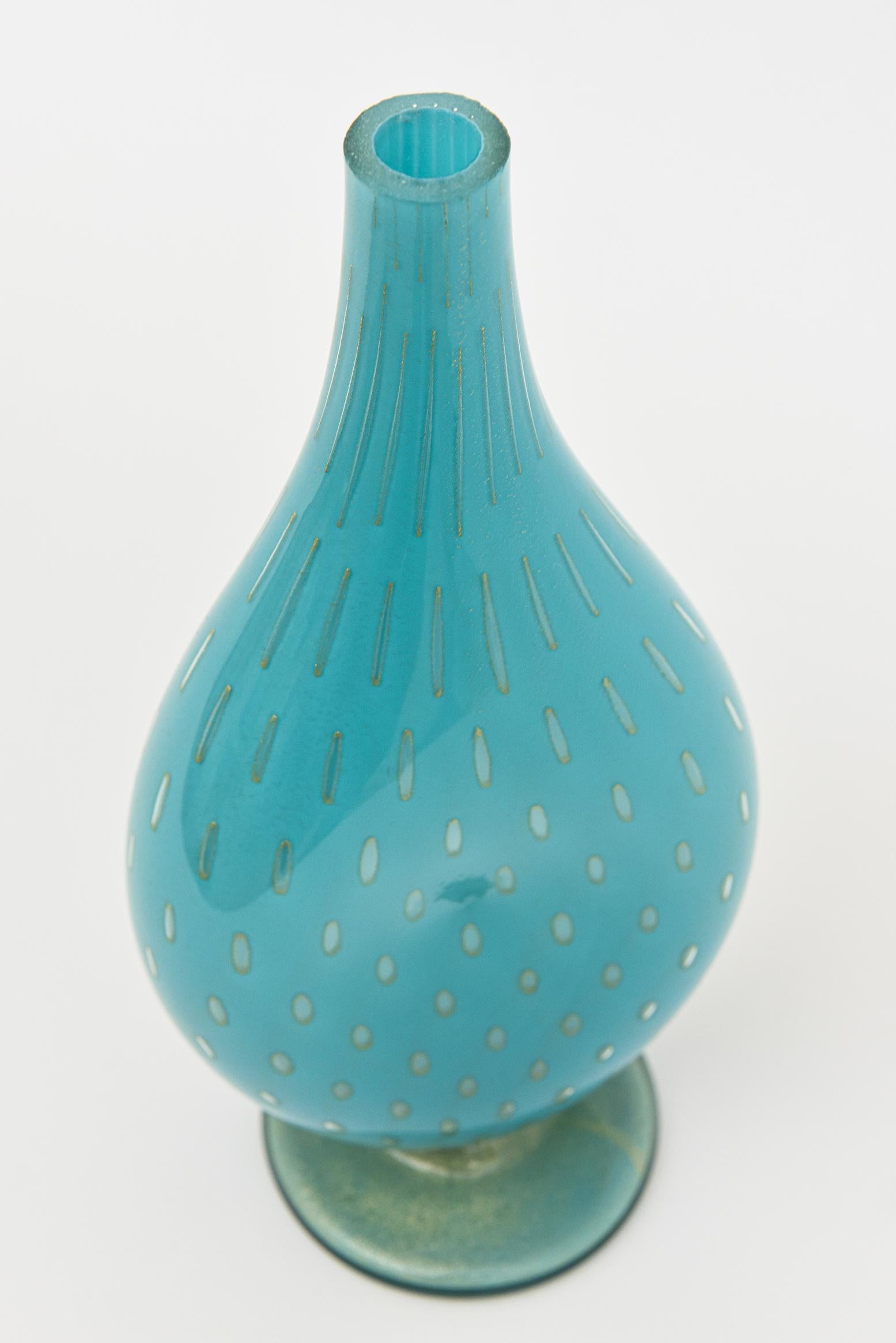 This gorgeous vintage Murano glass bottle, vessel or object is the most spectacular turquoise color which is most desirable and harder to come by. it is by the masters of glass Barovier &Toso. It has a flat cut polished top. The gold aventurine on
