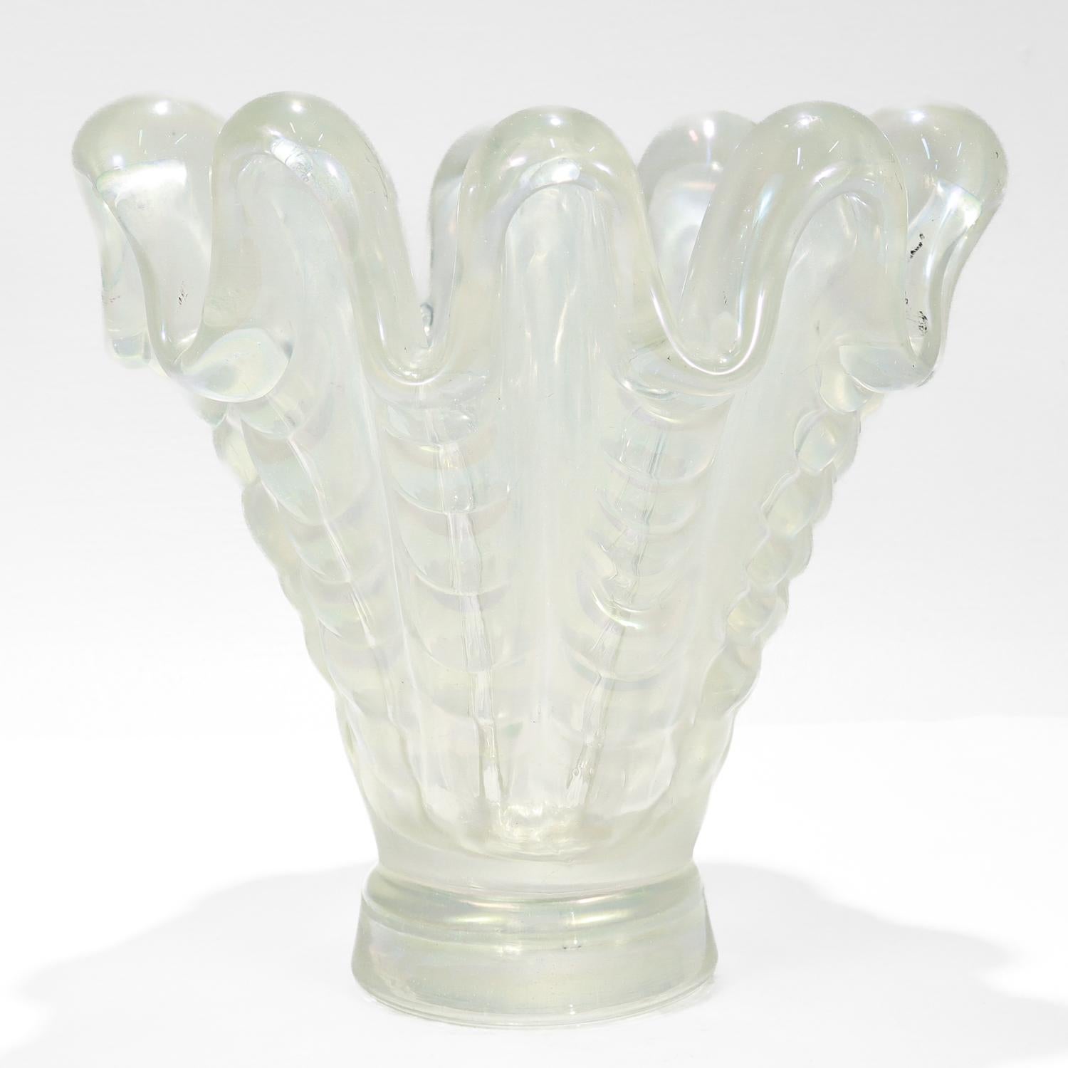 A fine vintage Murano art glass vase.

By Ercole Barovier for Barovier & Toso.

From the 'A Grosse Costolature' series.

With a fan-shaped form in heavy, iridescent glass with pronounced lobes & deep ribbing.

Simply a wonderful Italian art glass