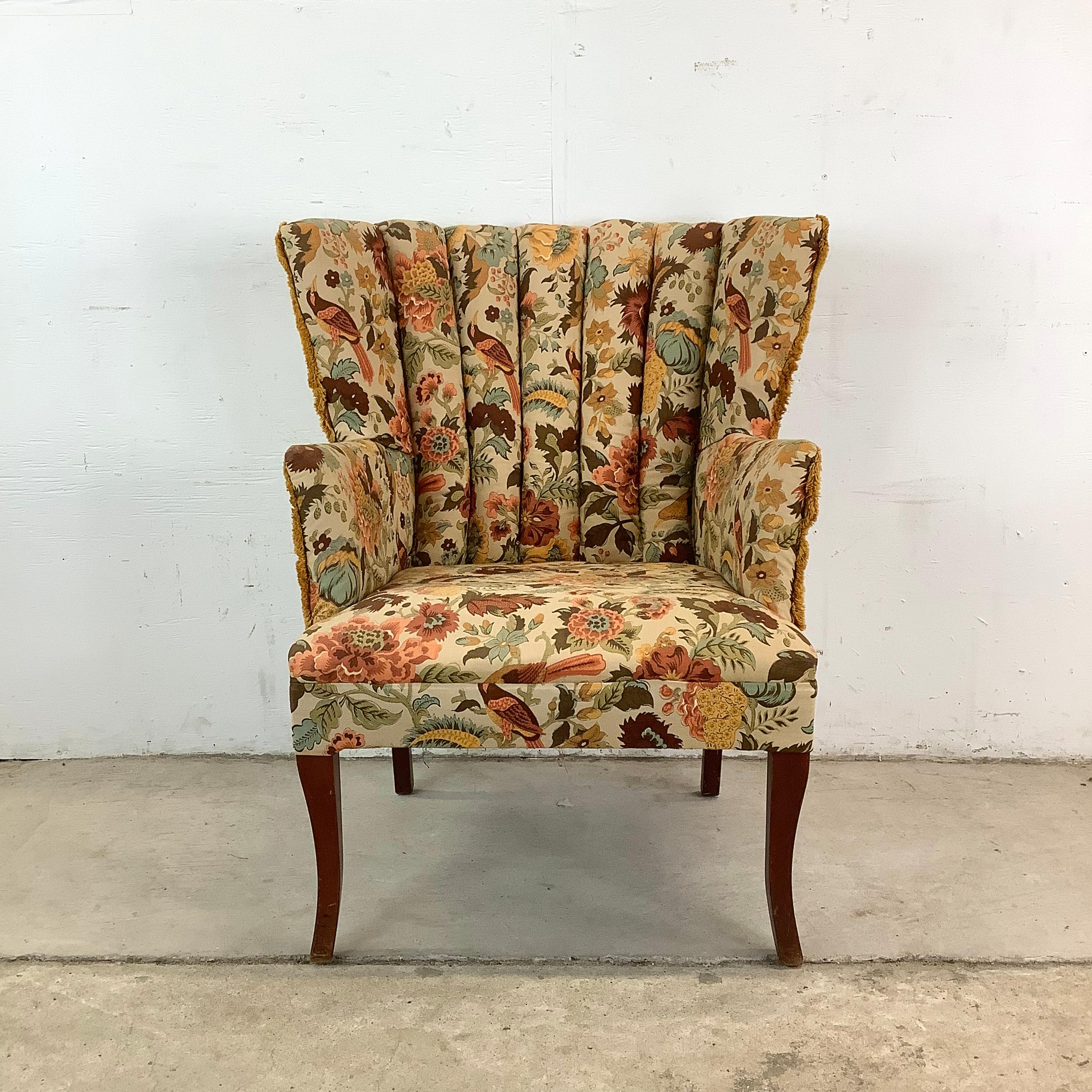 Step into a world of vintage elegance with this beautiful 20th century channel back armchair. With its graceful curves, vibrant upholstery, and inviting proportions, this chair is ready to become a favorite spot in your home.

The flower and bird