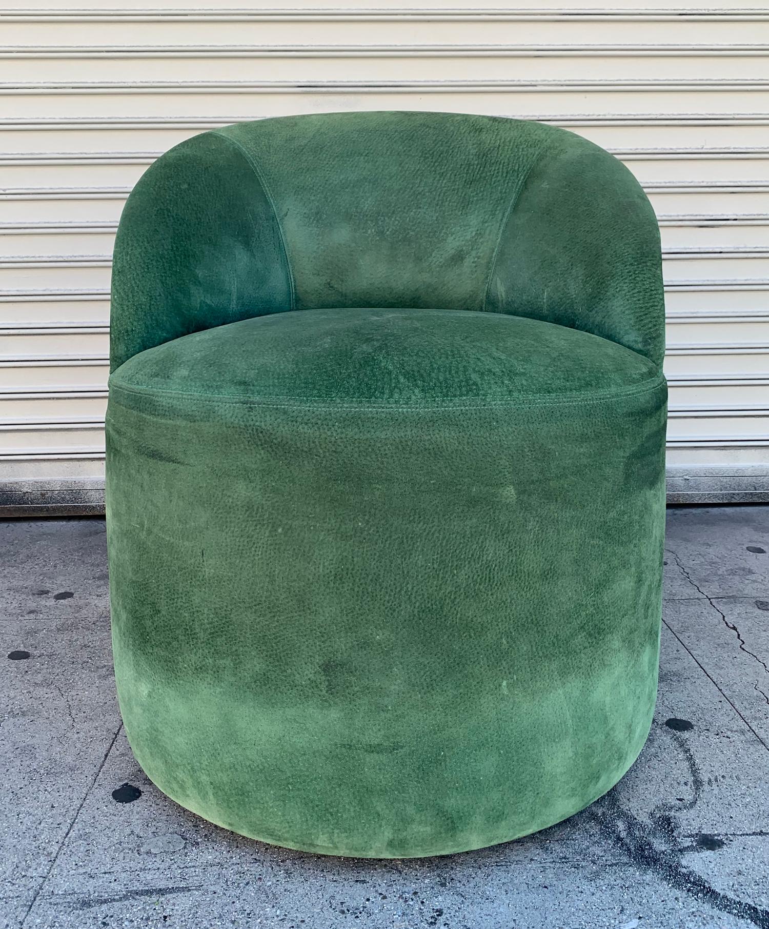 The chair is in good condition however it shows wear and either needs to be professionally cleaned or reupholstered, the suede has no holes or tears but it does have some soiled areas and marks.
The chair has casters and is easy to move around or