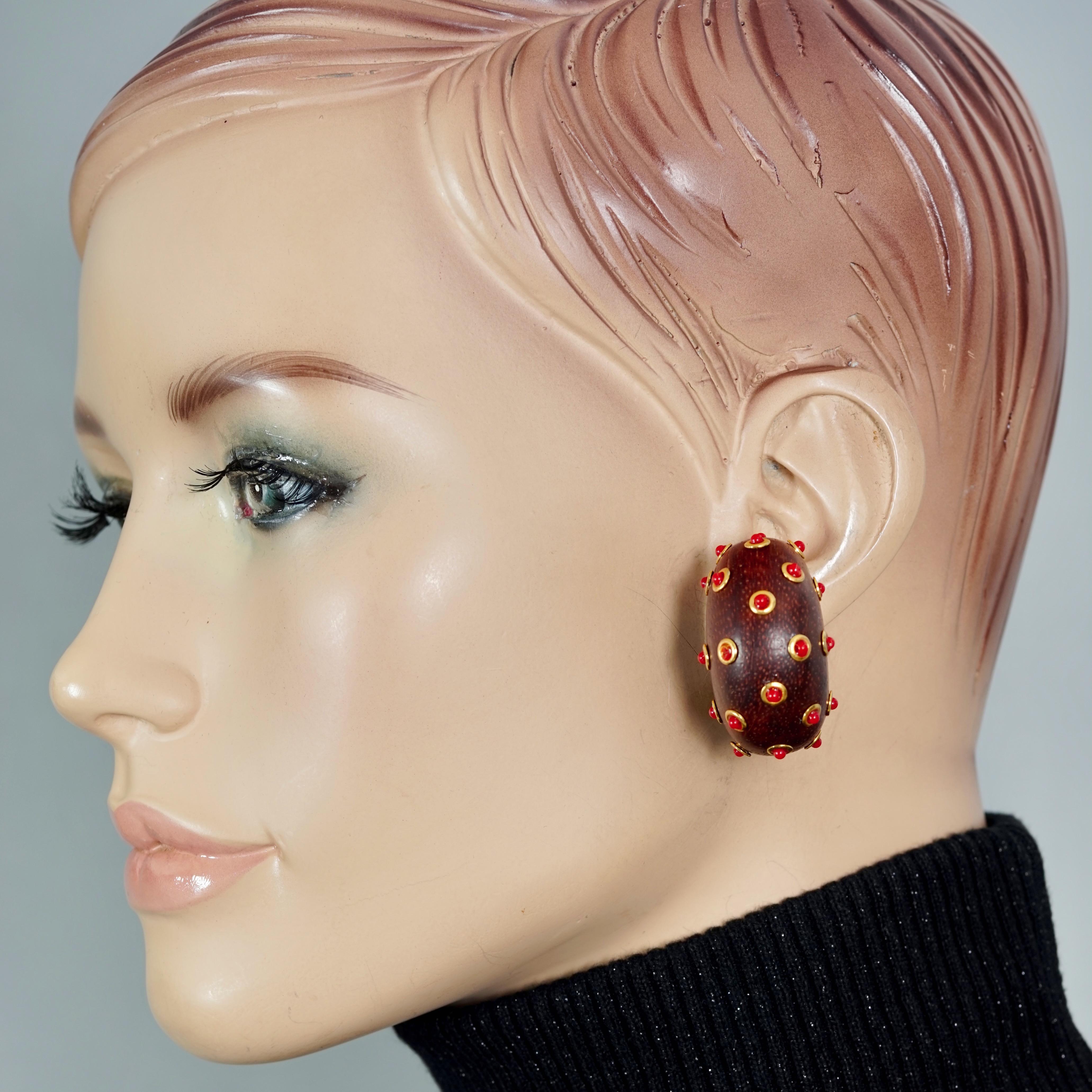 Vintage BARRERA Sputnik Wood Beaded Hoop Earrings

Measurements:
Height: 1.57 inches (4 cm)
Width: 0.83 inch (2.1 cm)
Weight per Earring: 12 grams

Features:
- 100% Authentic DOMINIQUE AURIENTIS.
- Wood hoop earrings with gold tone and orange glass